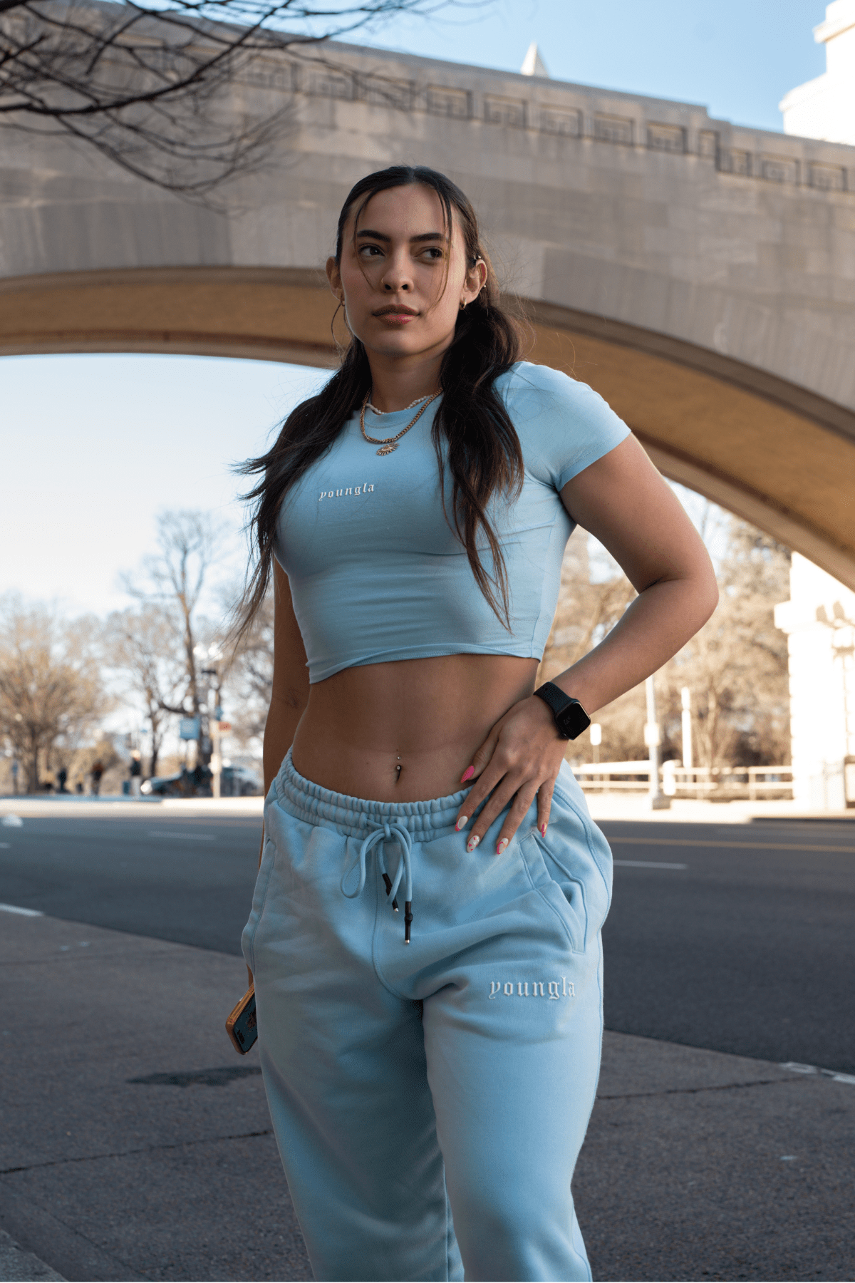 Model wearing the baby tee with stylish shorts for a casual look.