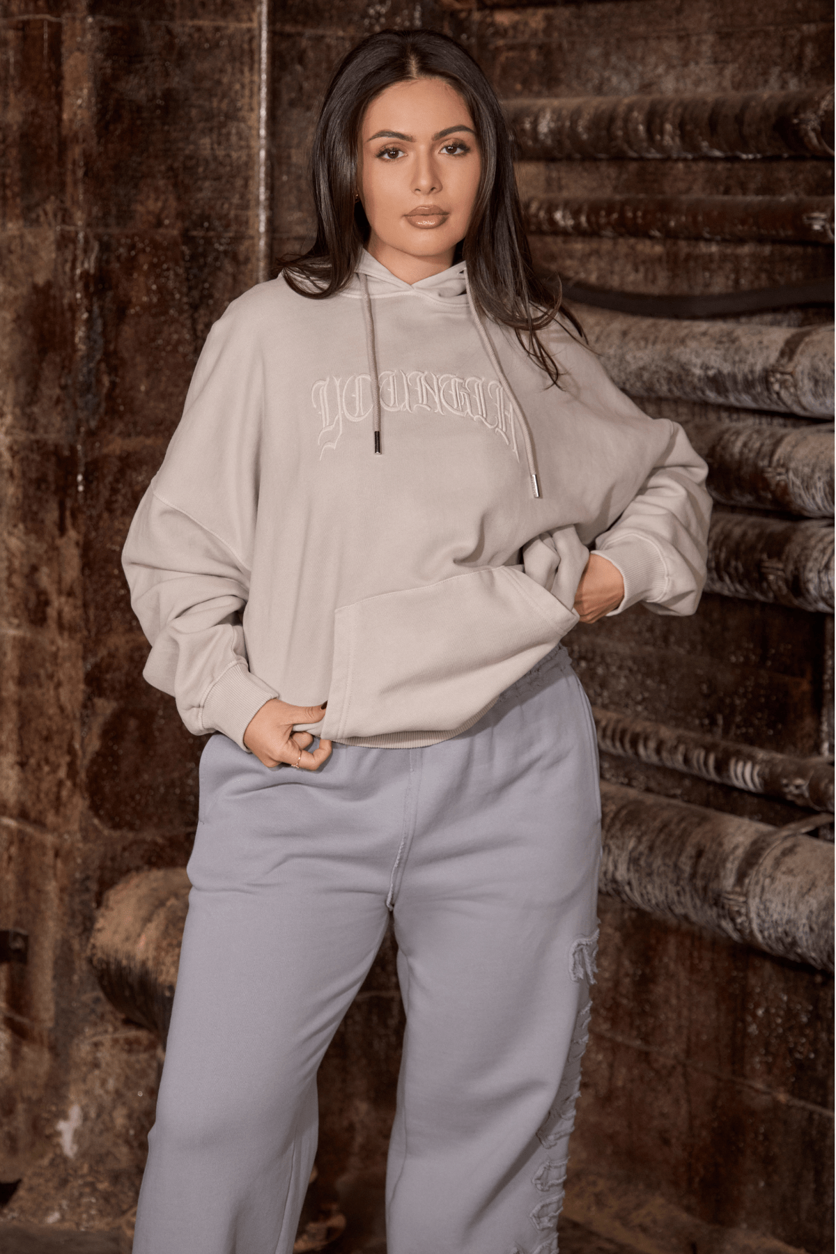 Front view of the embroidered hoodie showcasing detailed embroidery on soft cotton fabric