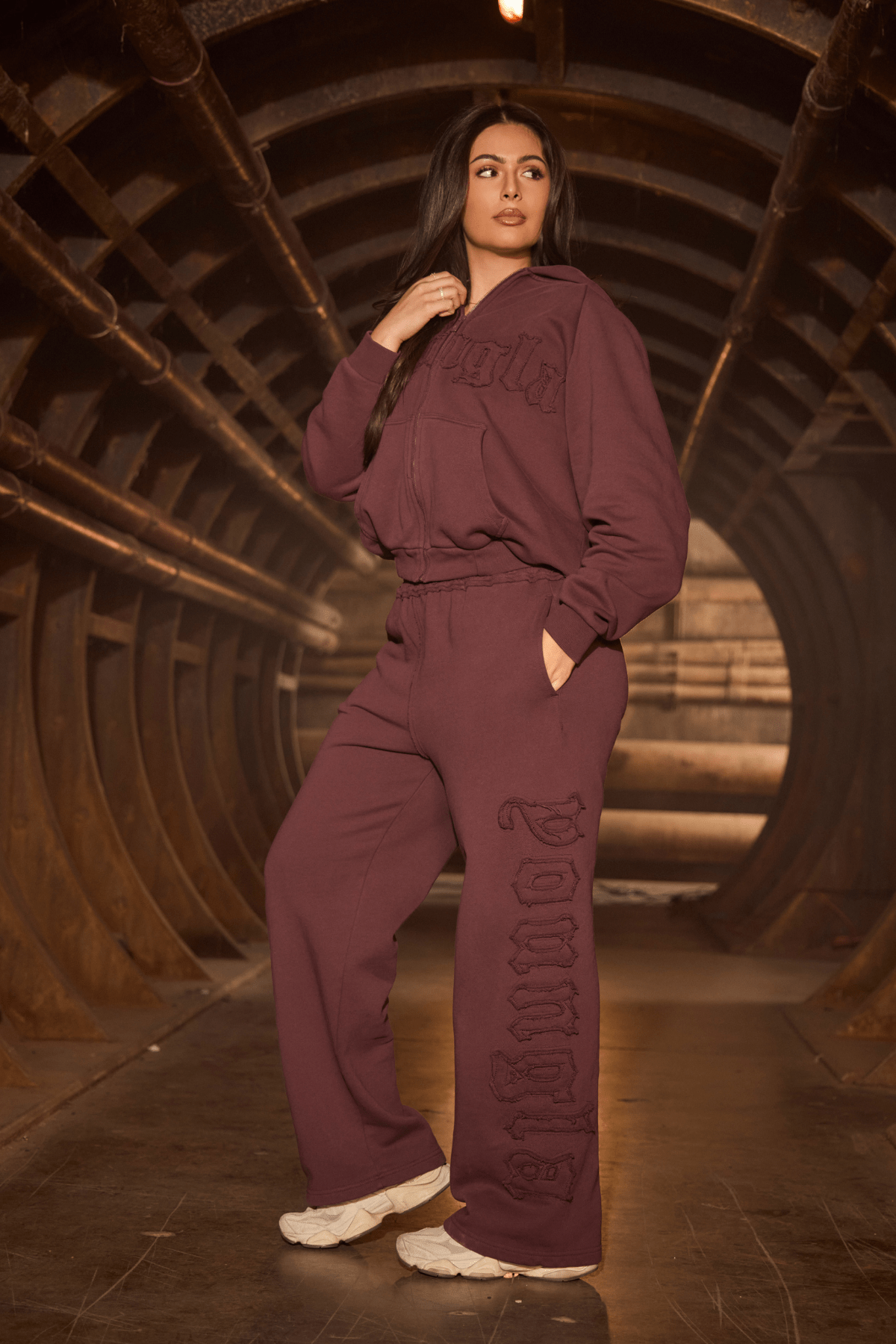 Model lounging in organic cotton joggers, ideal for everyday wear.