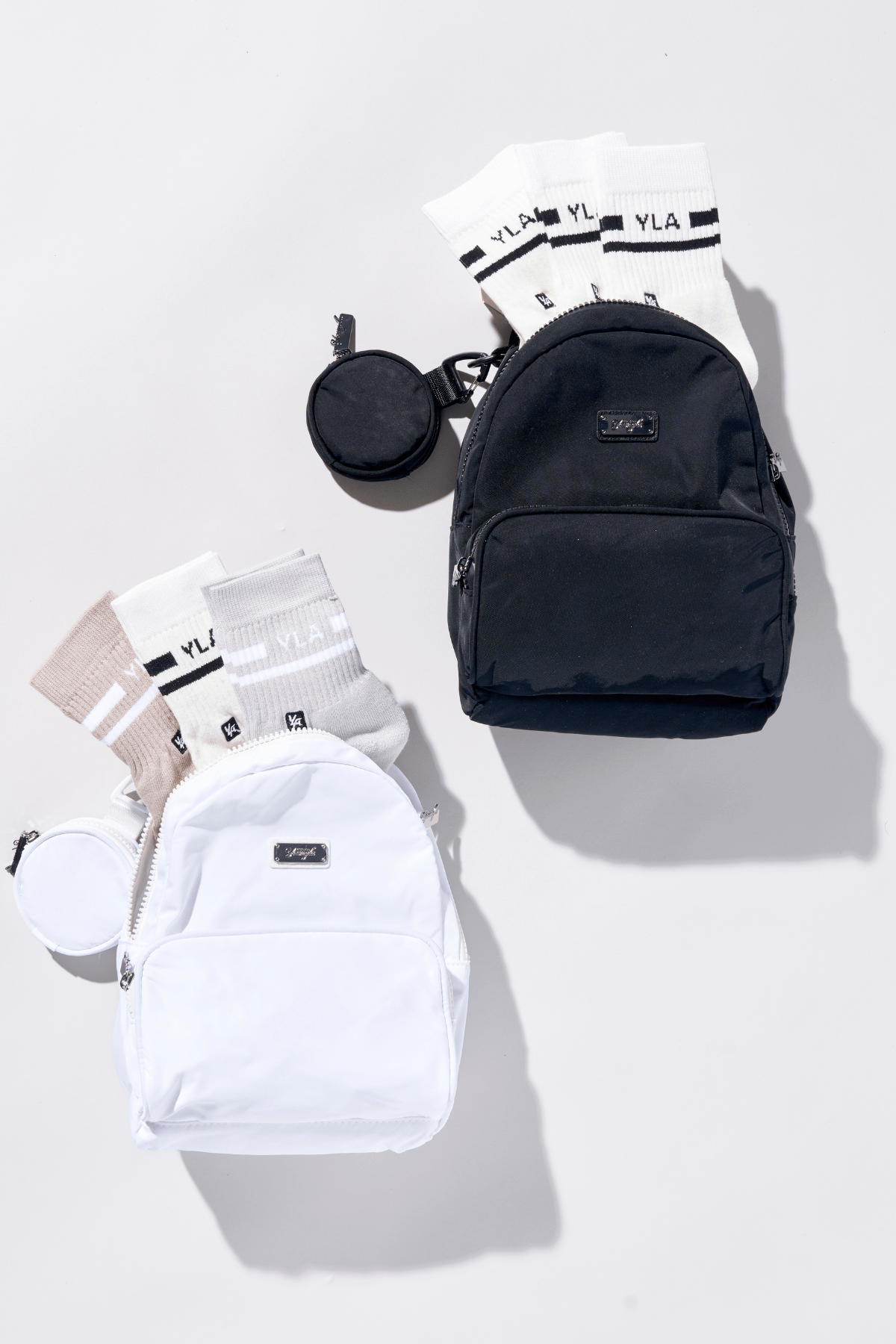Fun sized backpack with open compartments holding travel essentials