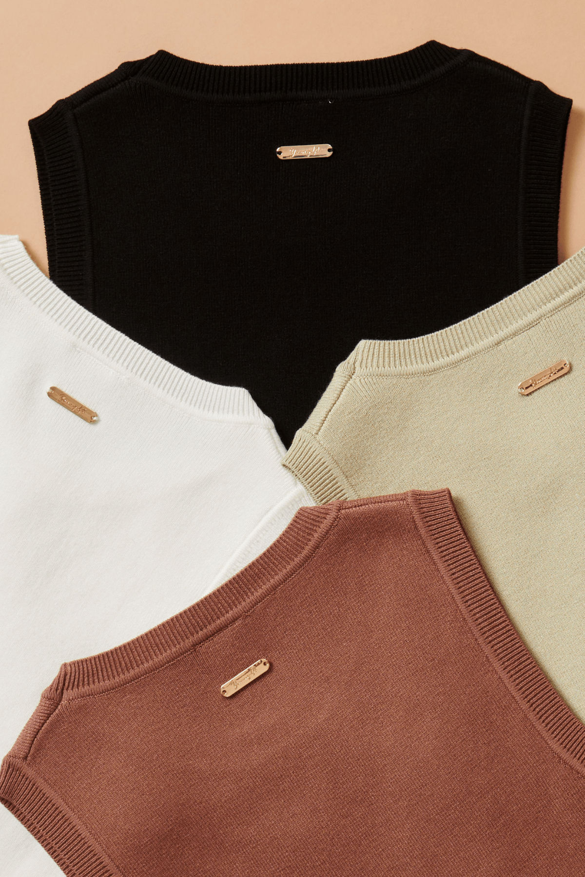 White crop top layered under a jacket for transitional weather styling