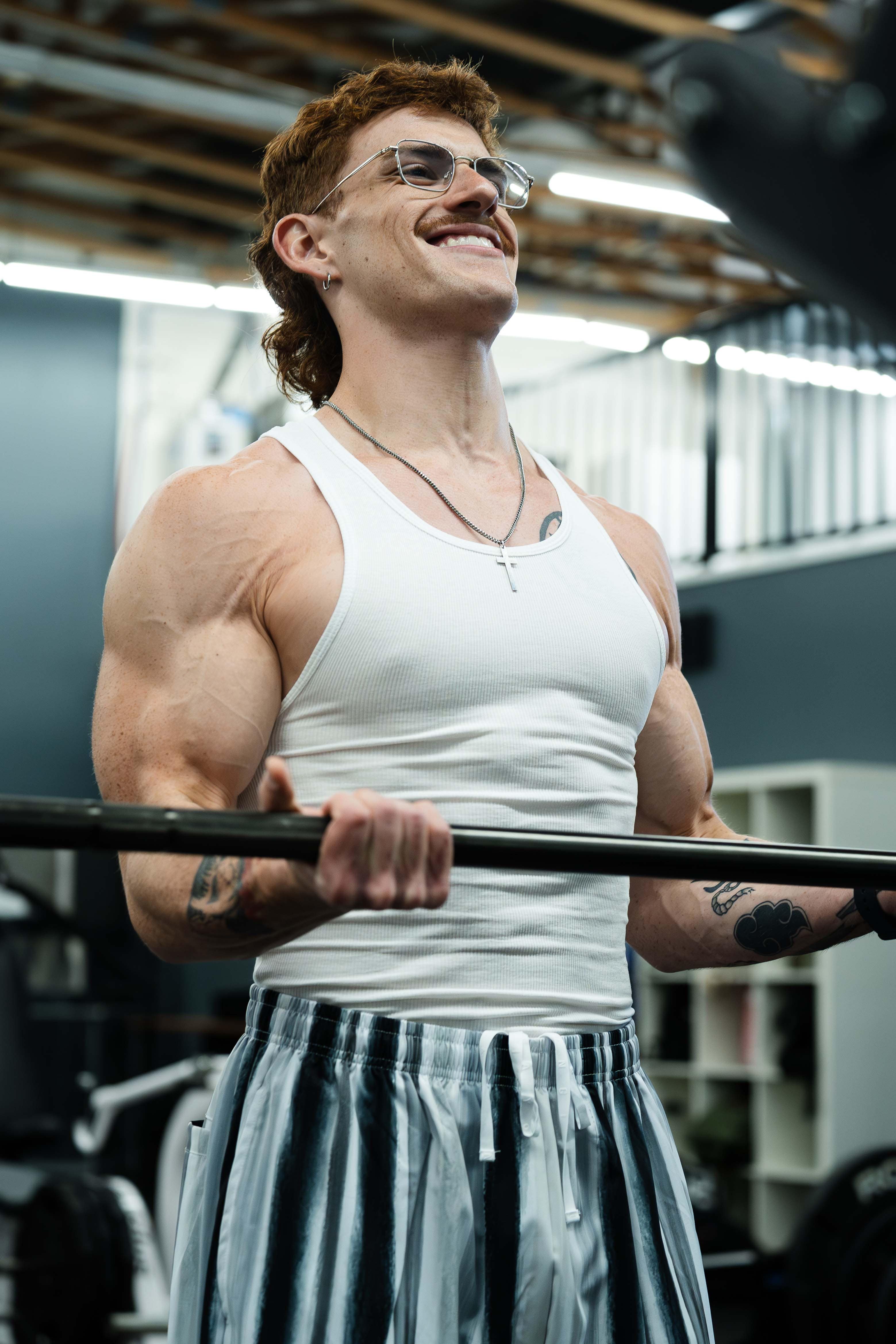 Folded black tank top from pack 1 – sleek gym-ready styling
