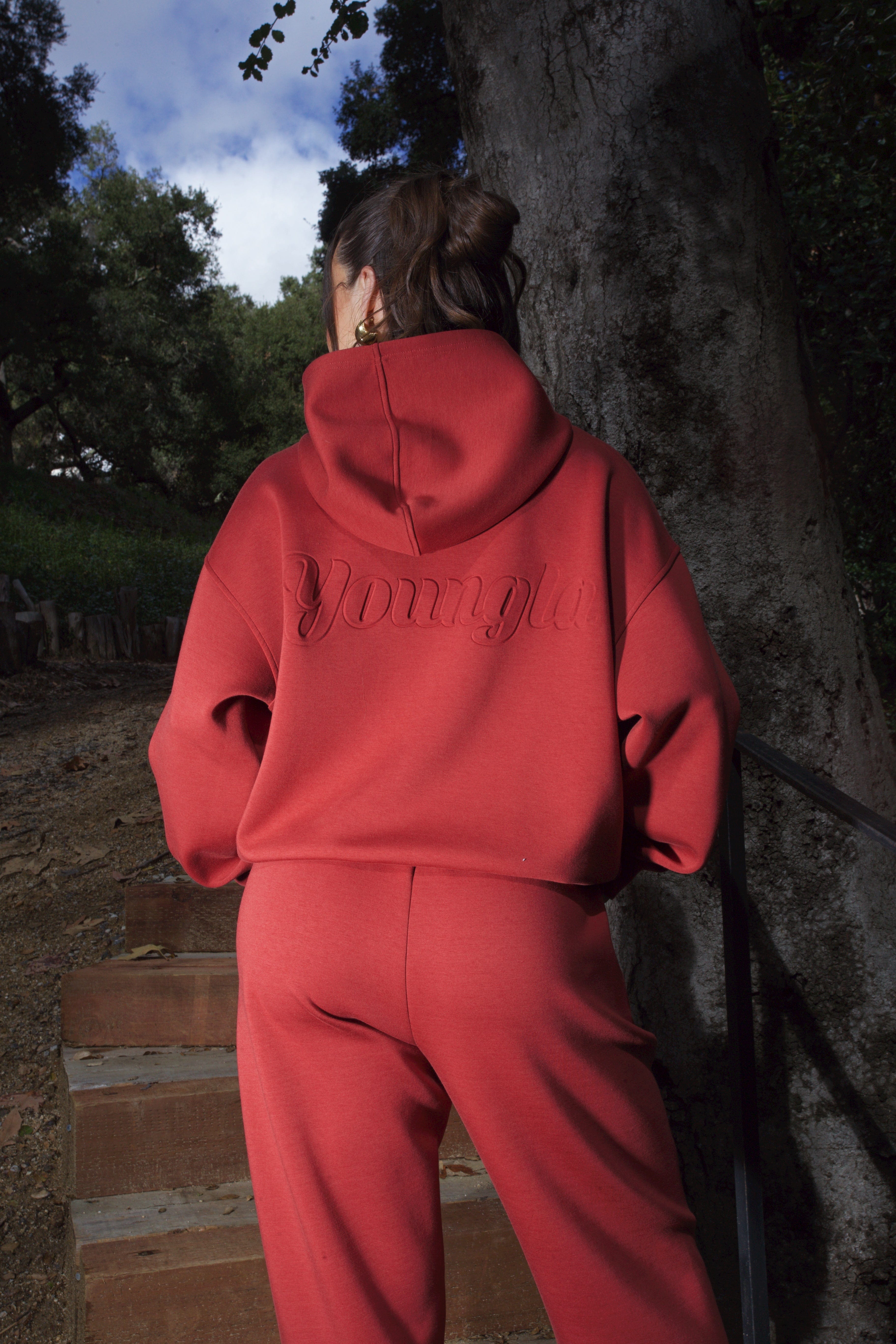 Close-up of the debossed logo on the scuba hoodie, highlighting its quality.