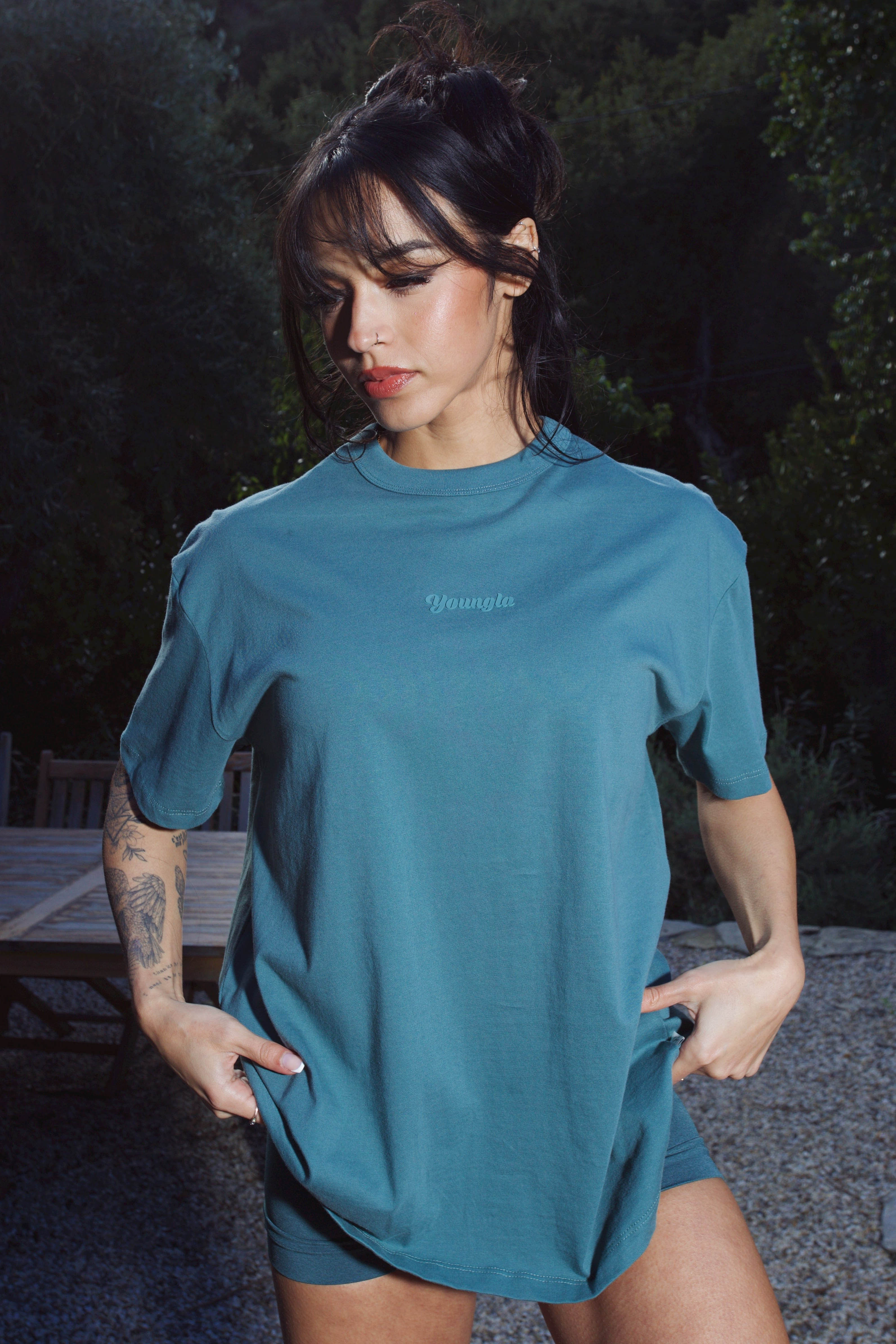 Side angle of the oversized t shirt, highlighting the soft cotton material.