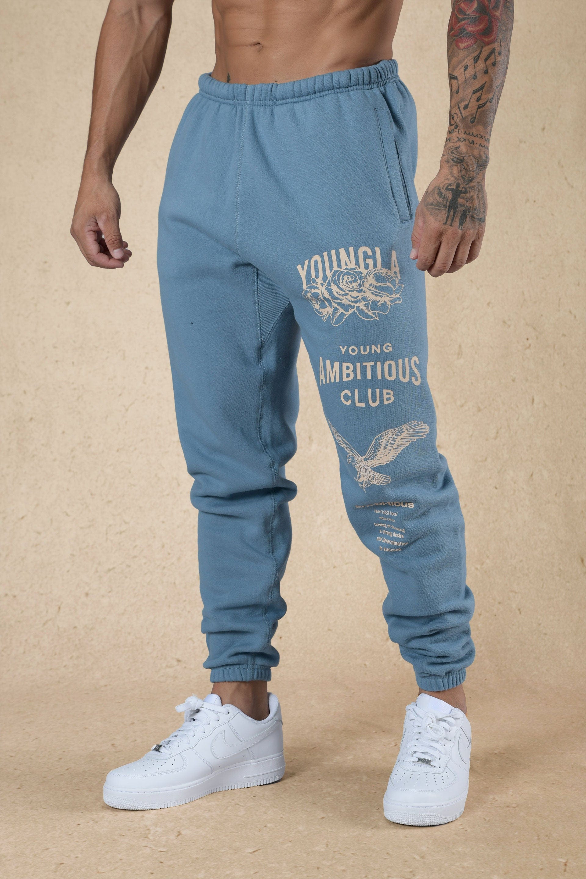 Front angle view of mens joggers showcasing oversized fit and printed leg design