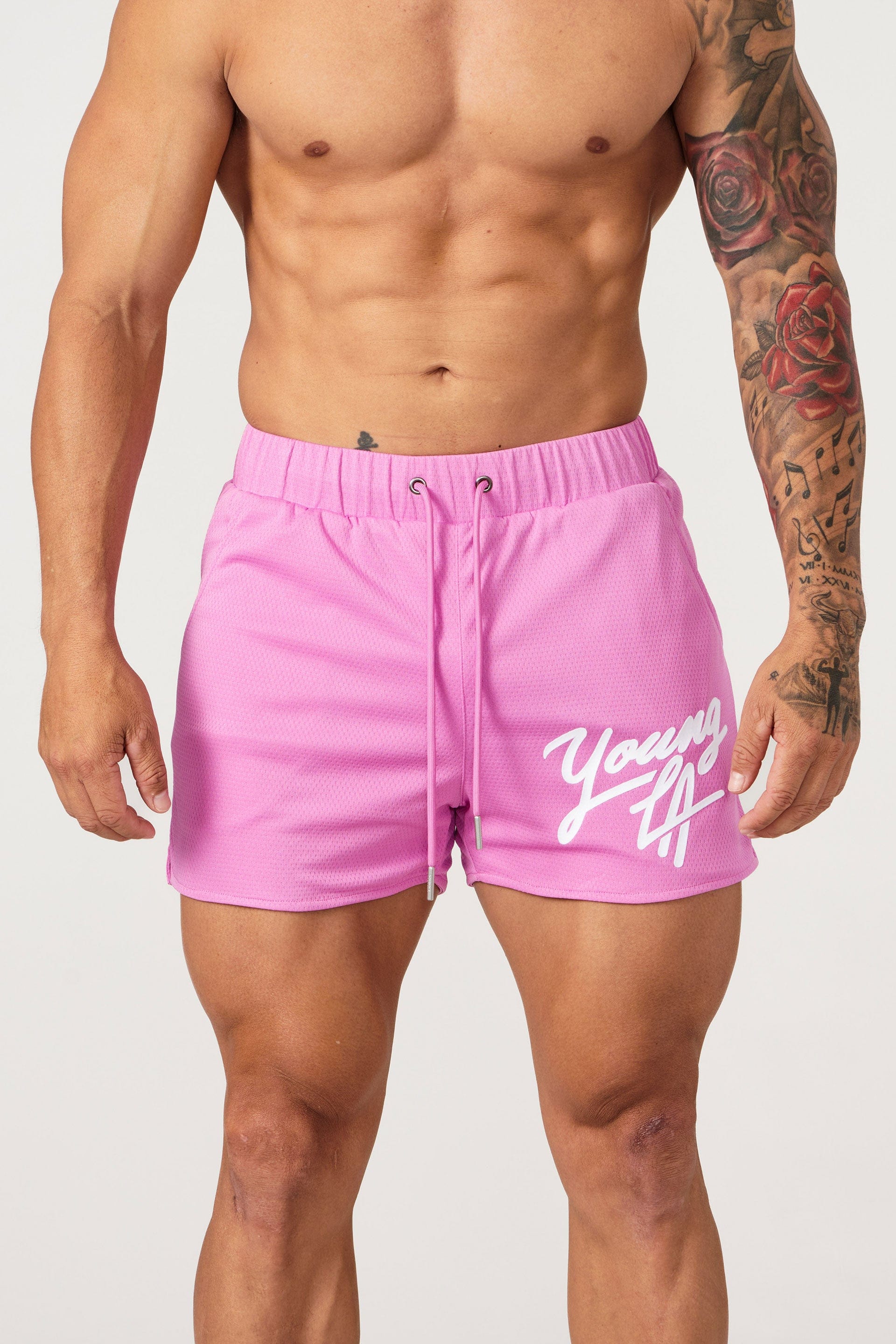 Athlete performing squats in Legacy shorts outdoors