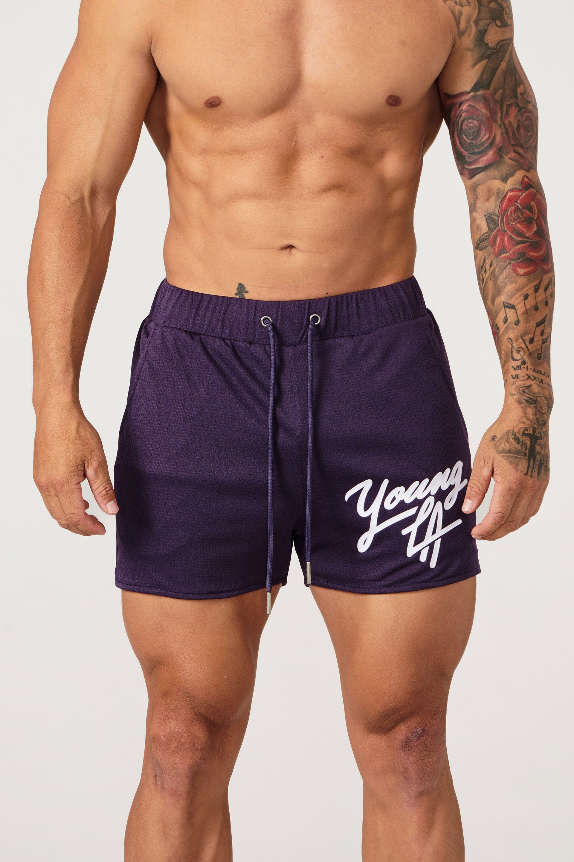 Side profile view showing pocket placement on womens workout shorts