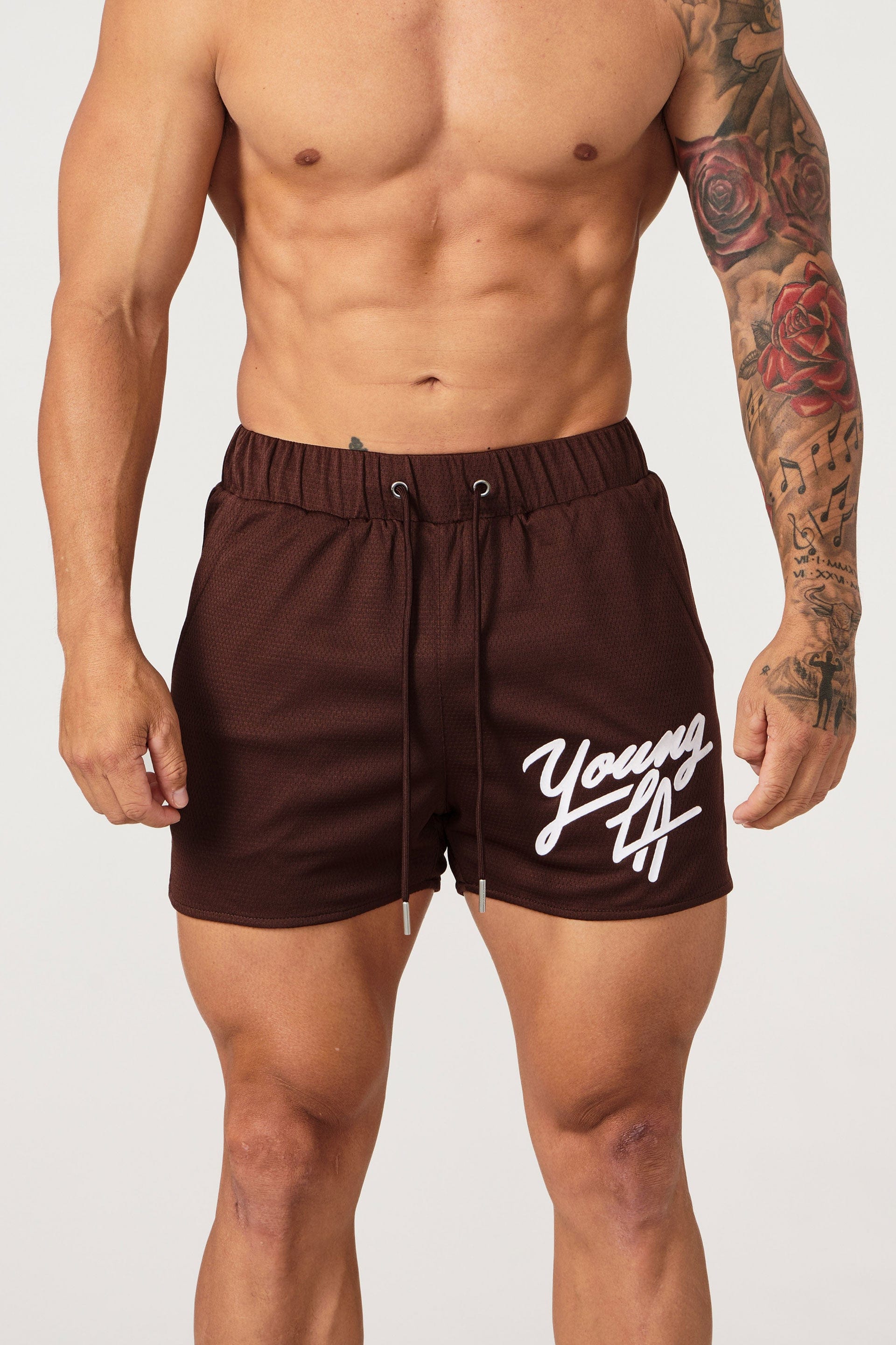 Side profile view showing pocket placement on womens workout shorts