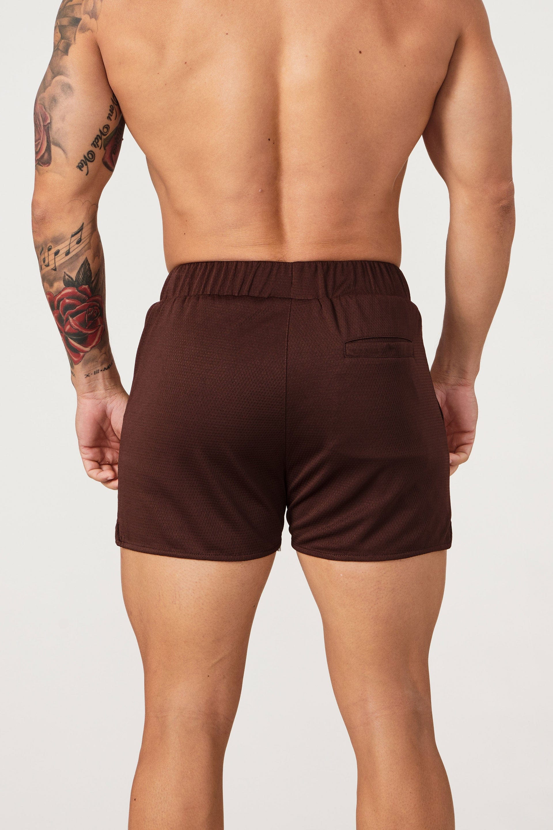 Side profile view showing pocket placement on womens workout shorts