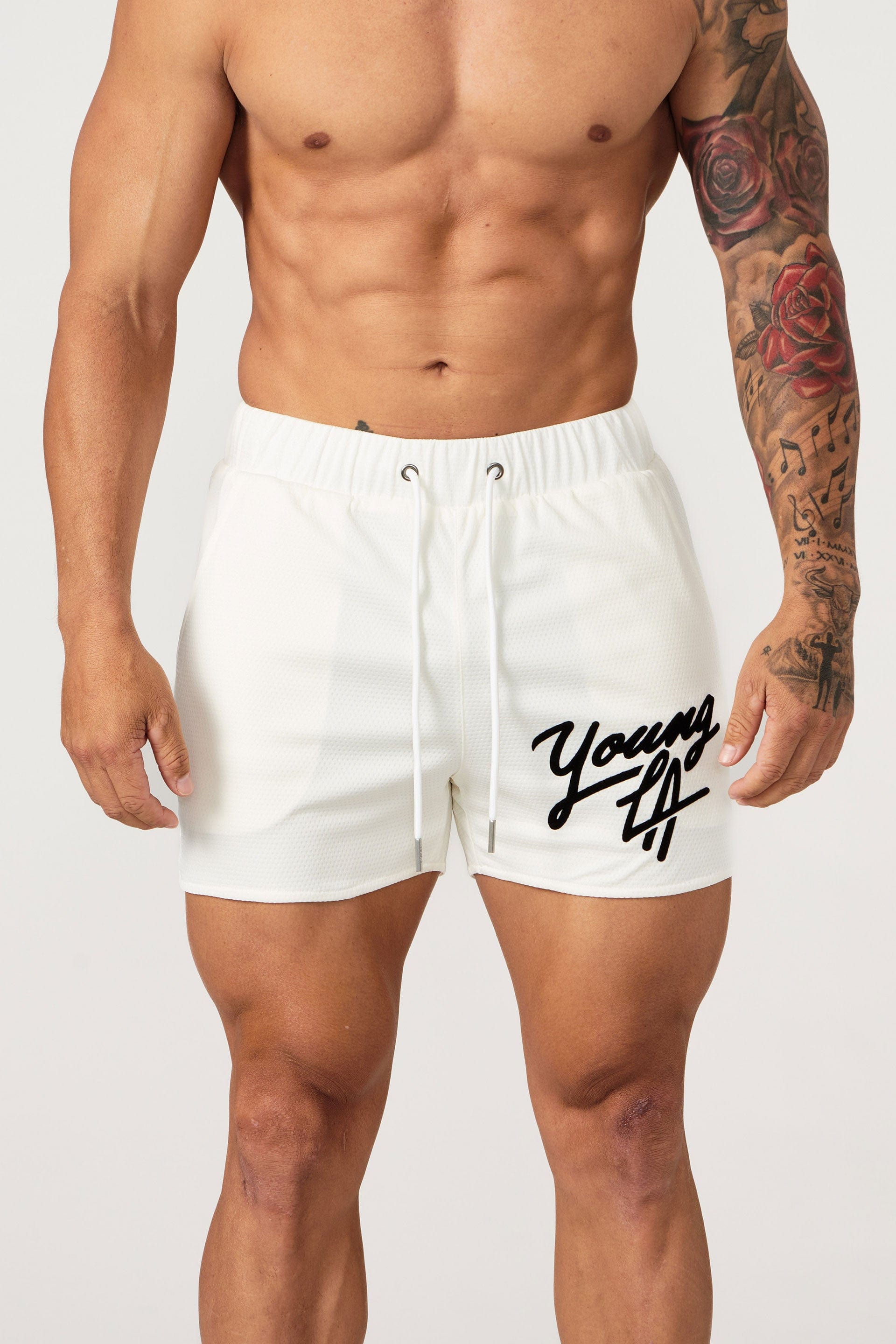 Athlete performing squats in Legacy shorts outdoors