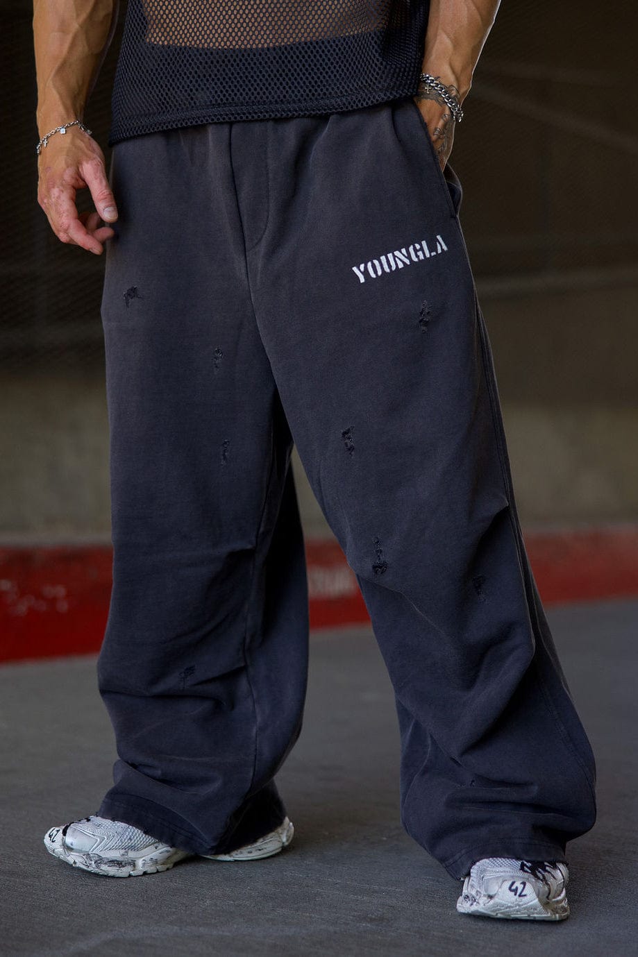 Side view showcasing the baggy fit of the cotton sweatpants.