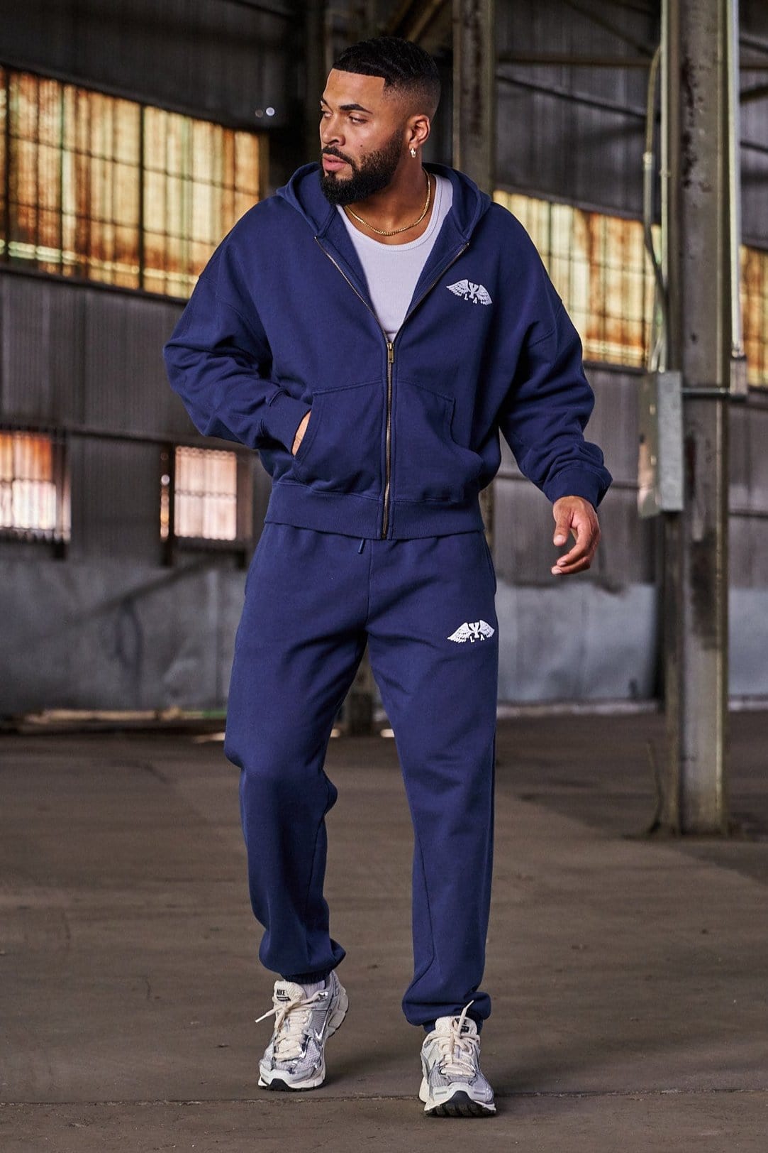 Front and back view of mens sweats in a neutral tone.