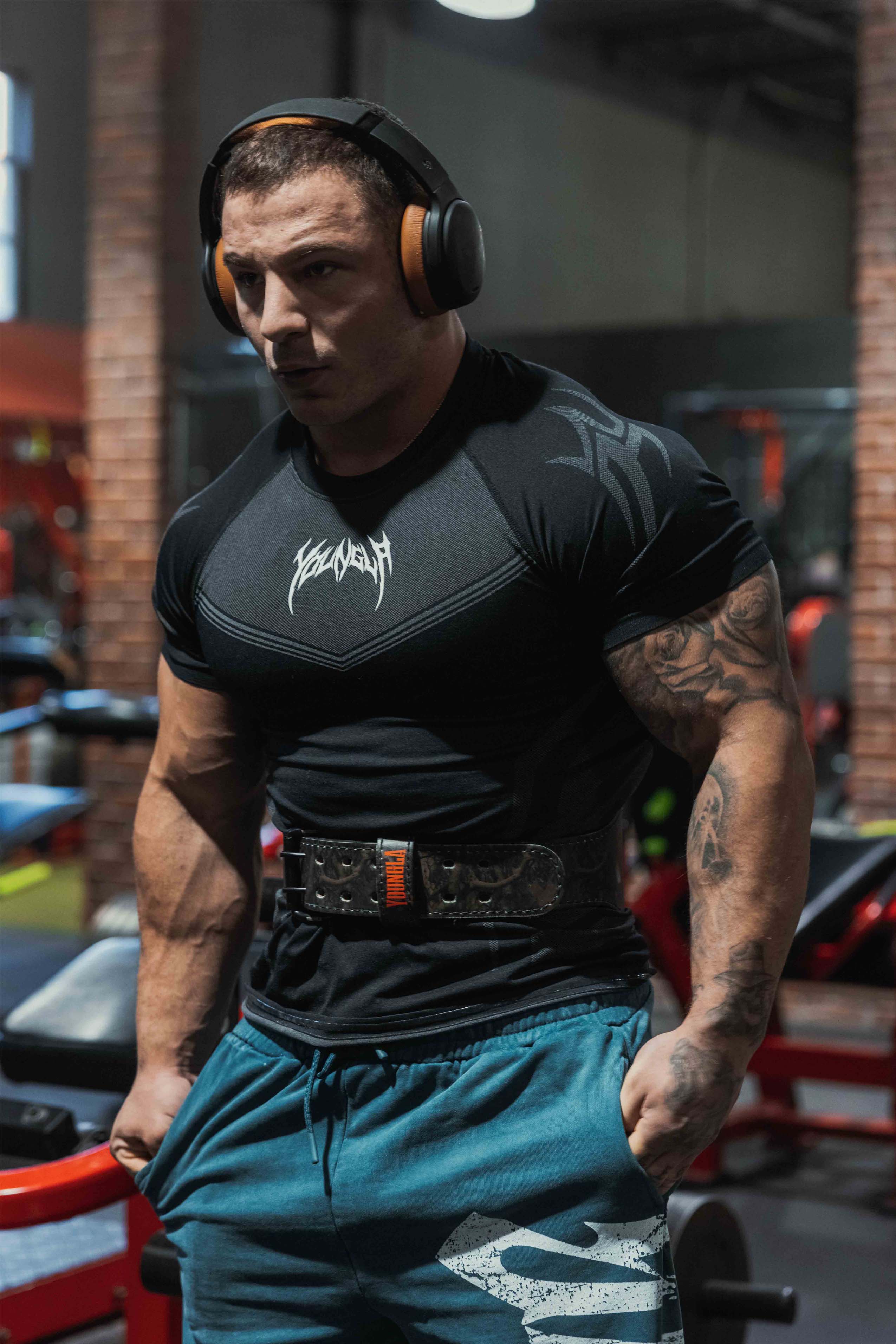 Side angle showcasing athletic fit and shoulder sculpting effect