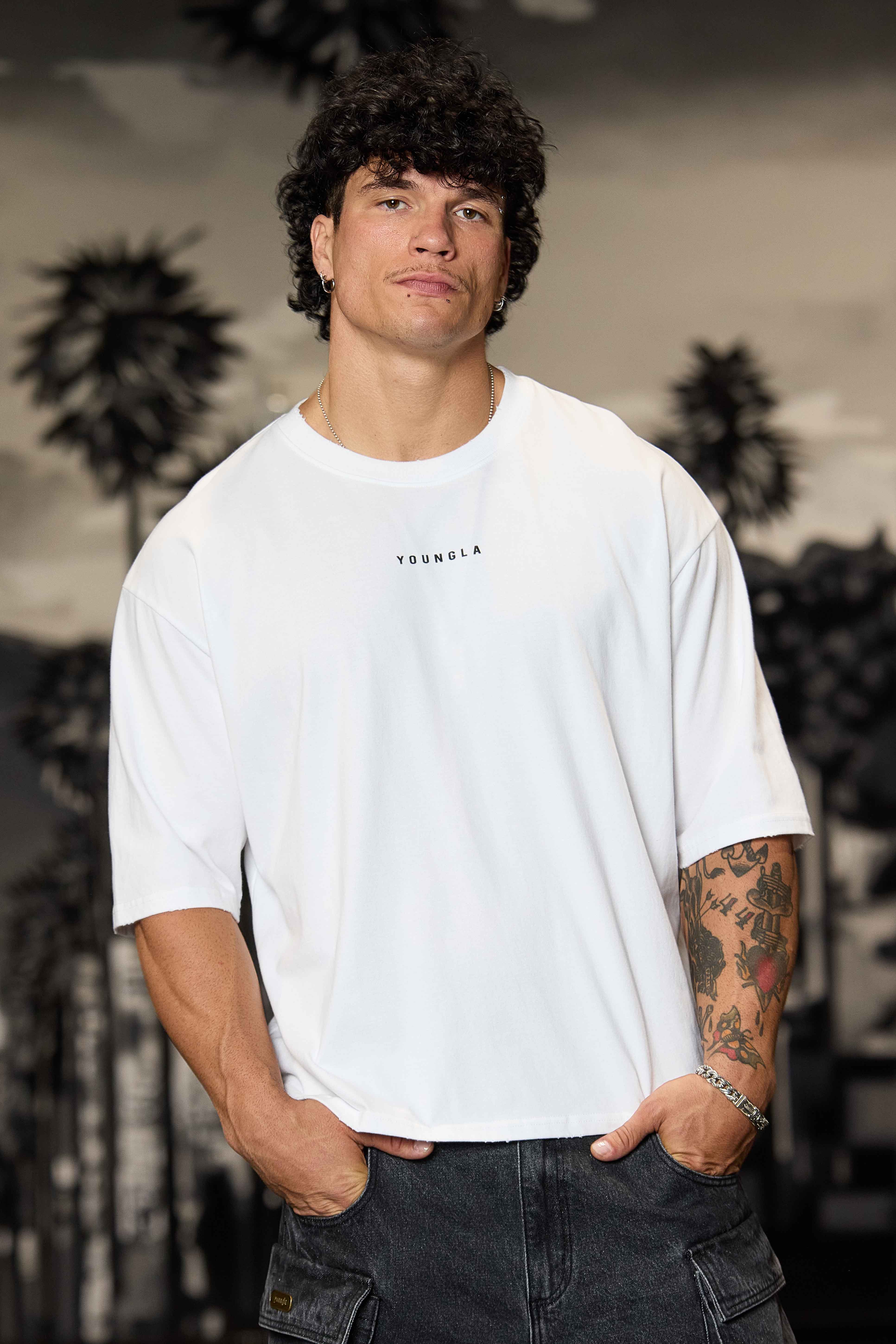 Close-up of the distressed collar and sleeve details on the Chaos tee.