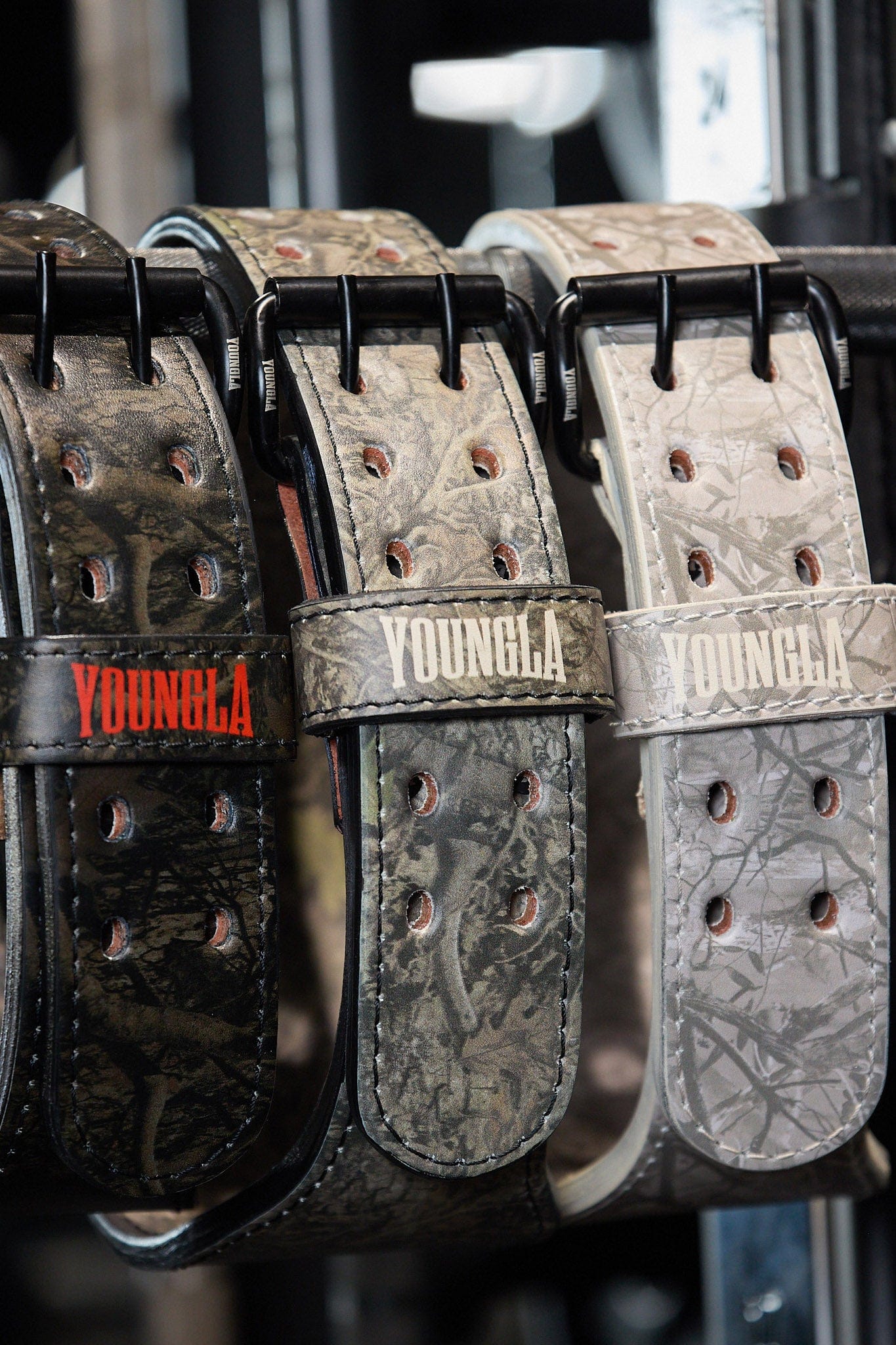 Close-up of the tree camo leather weightlifting belt showcasing its double prong design.