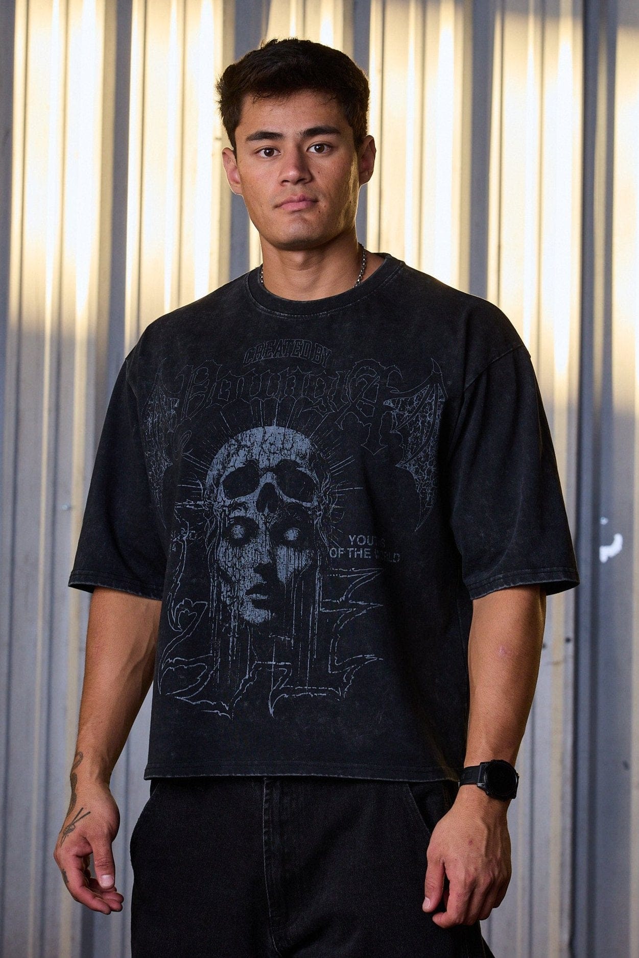 Front view of acid wash tee showing boxy fit and graphic design