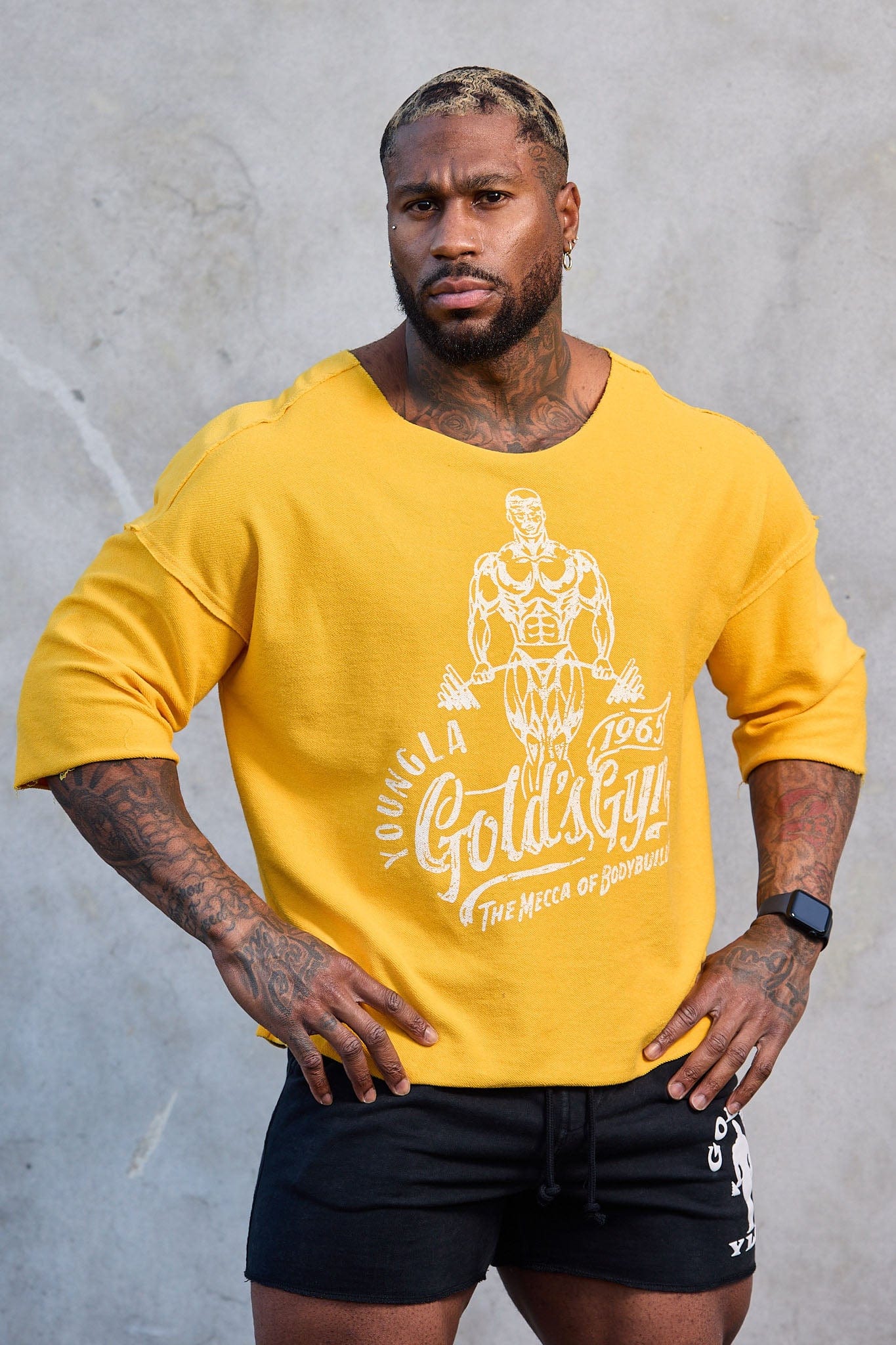 Side angle of the oversized gym t shirt, highlighting the wide neck design.