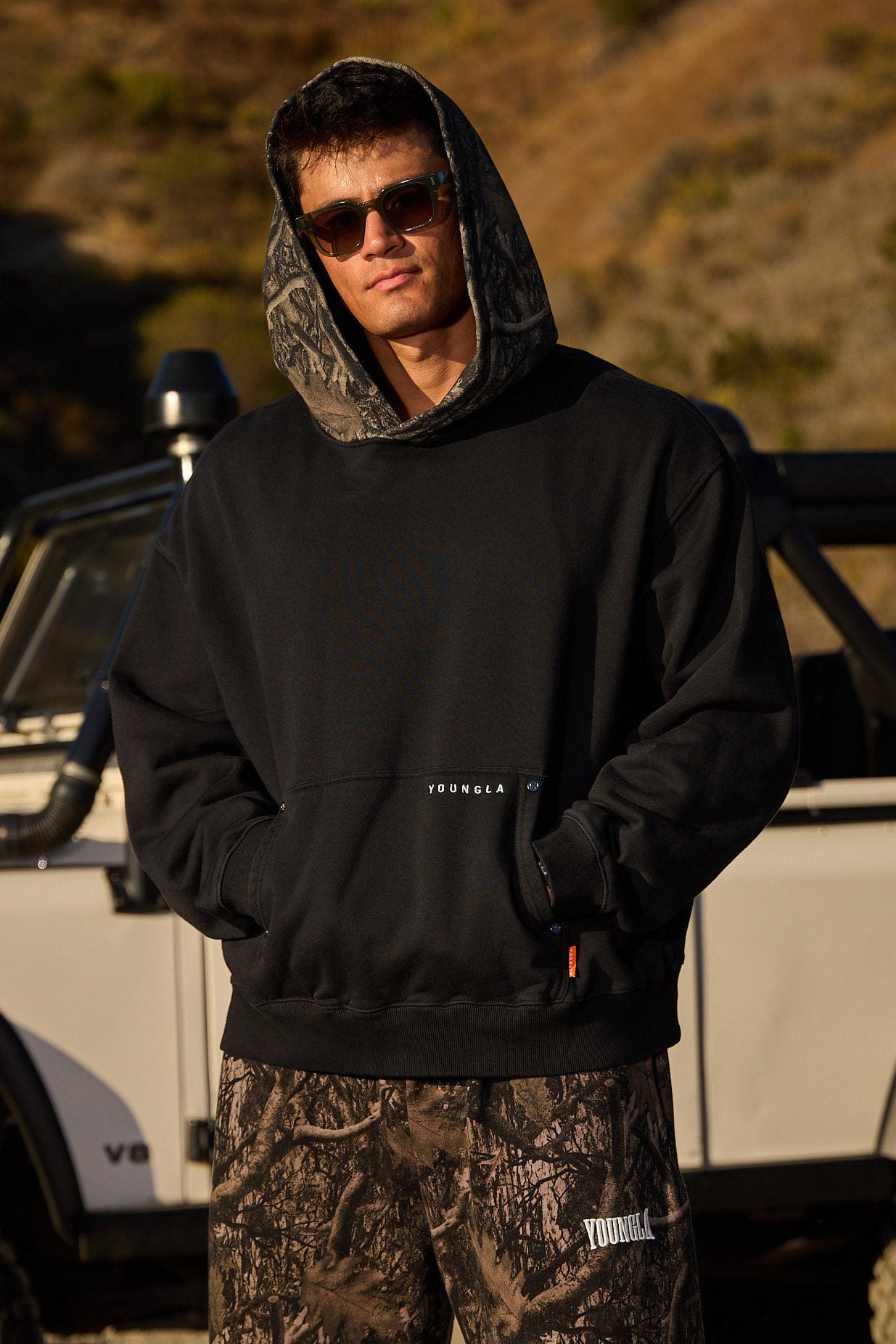 Front view of the tree camo hoodie, showcasing its relaxed fit.