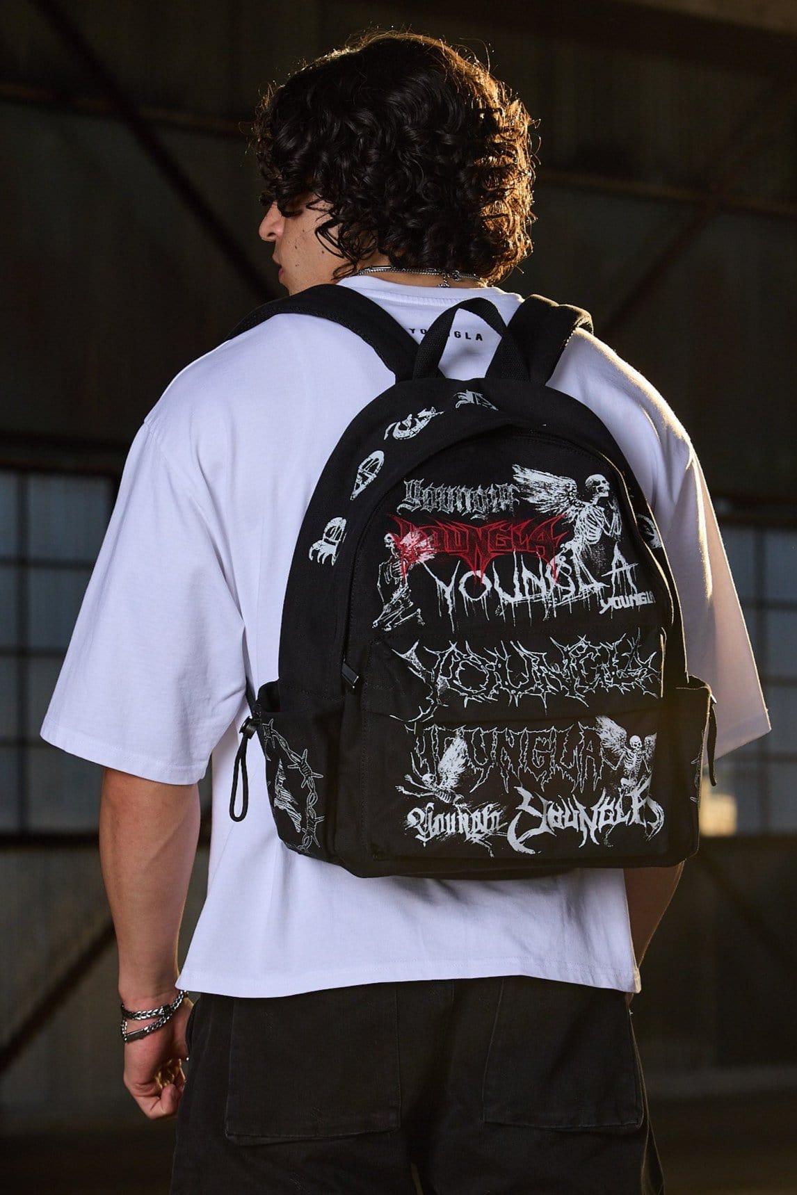 Side view showing adjustable pockets of canvas backpack