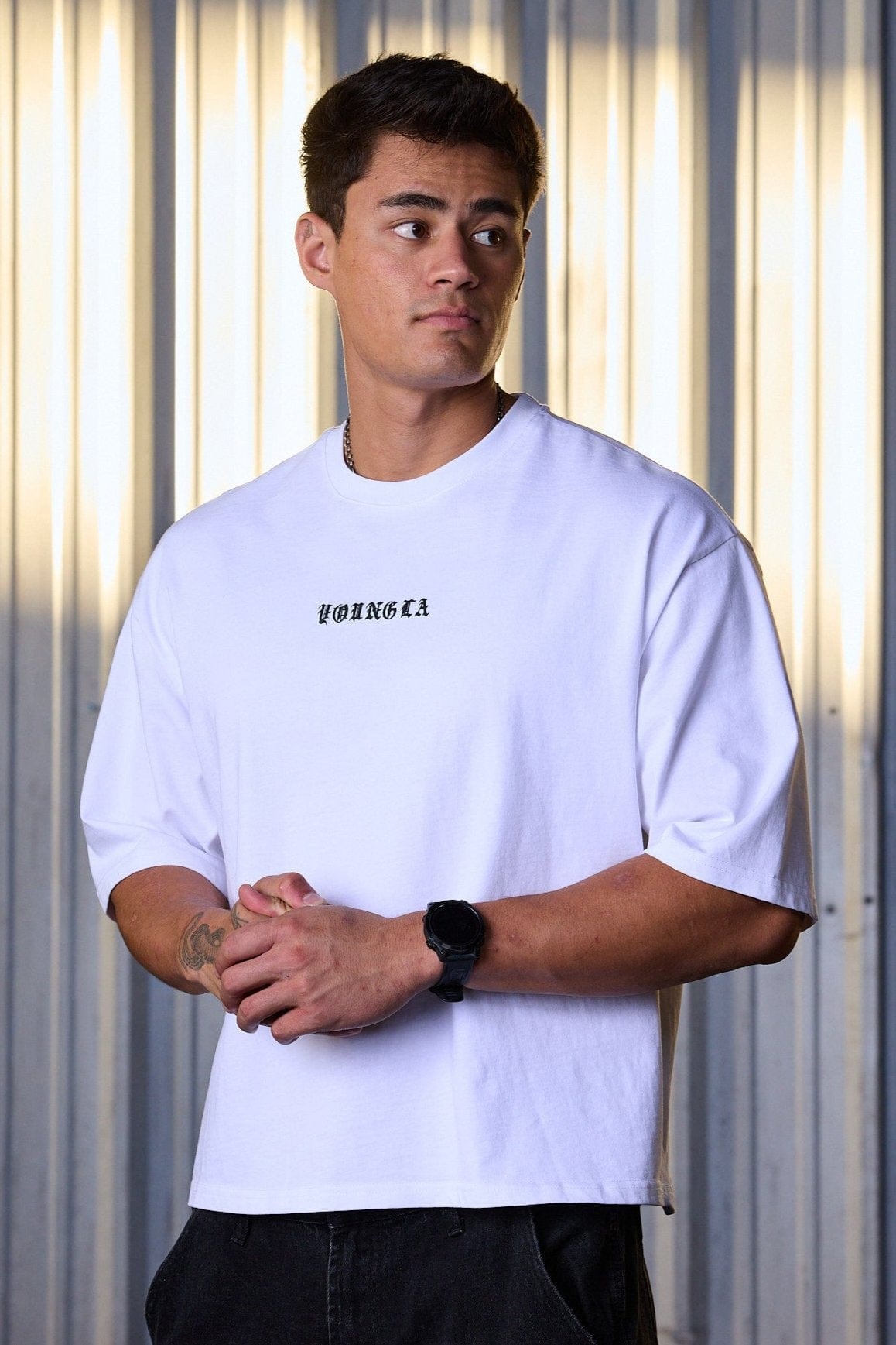 Acid wash tee in charcoal, unisex boxy fit, styled with jeans