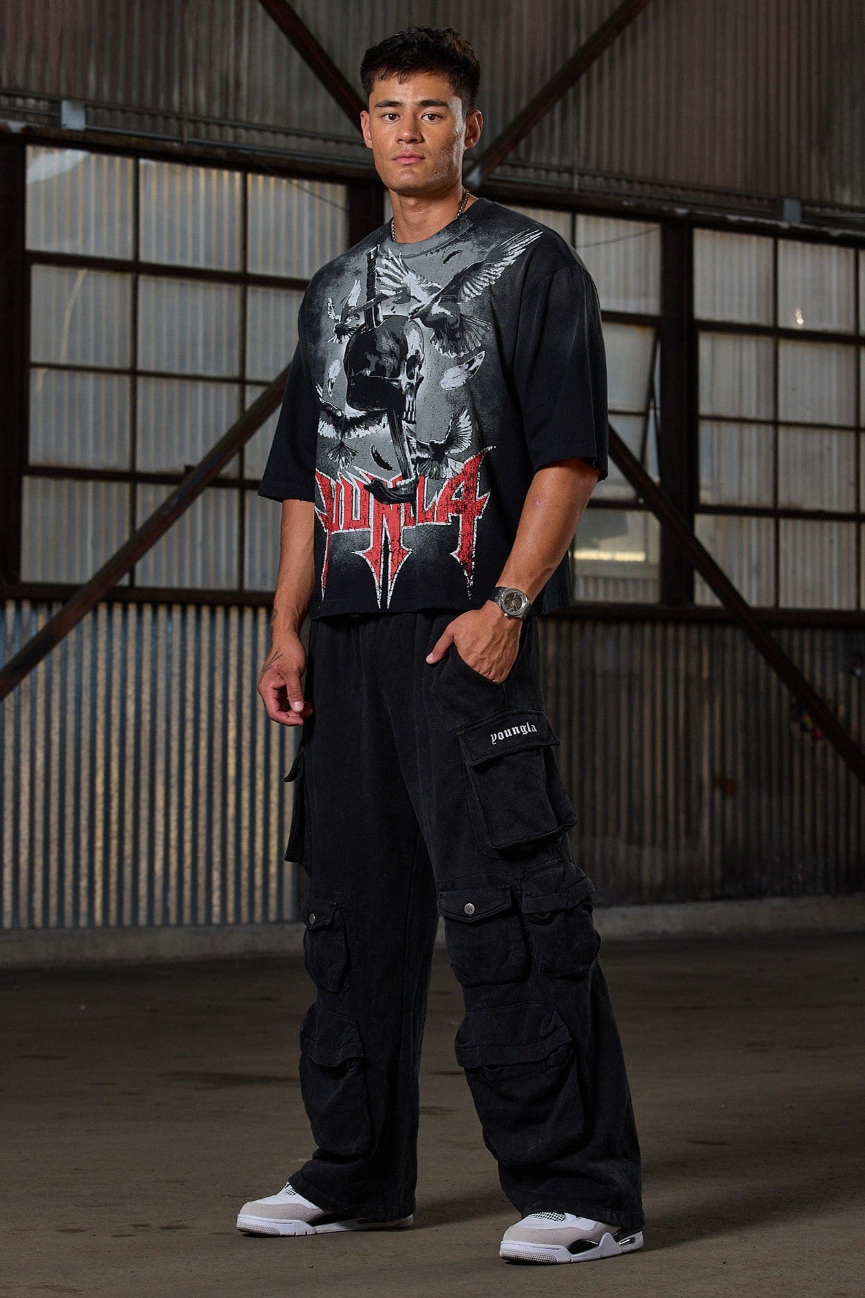 Cargo pocket close-up on mens joggers featuring YLA branding