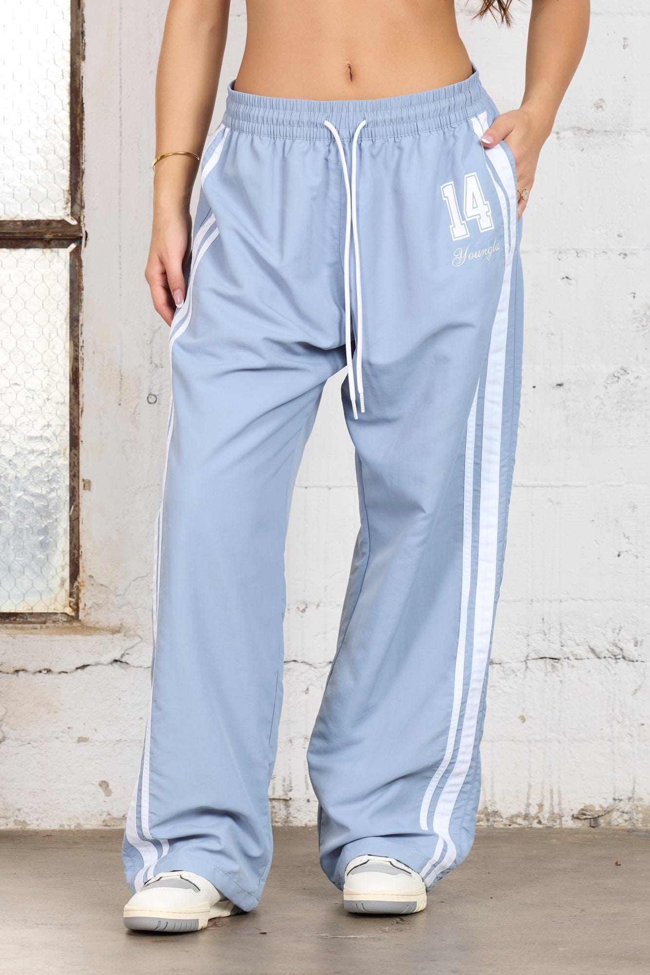 Front view of relaxed fit track pants perfect for daily use.