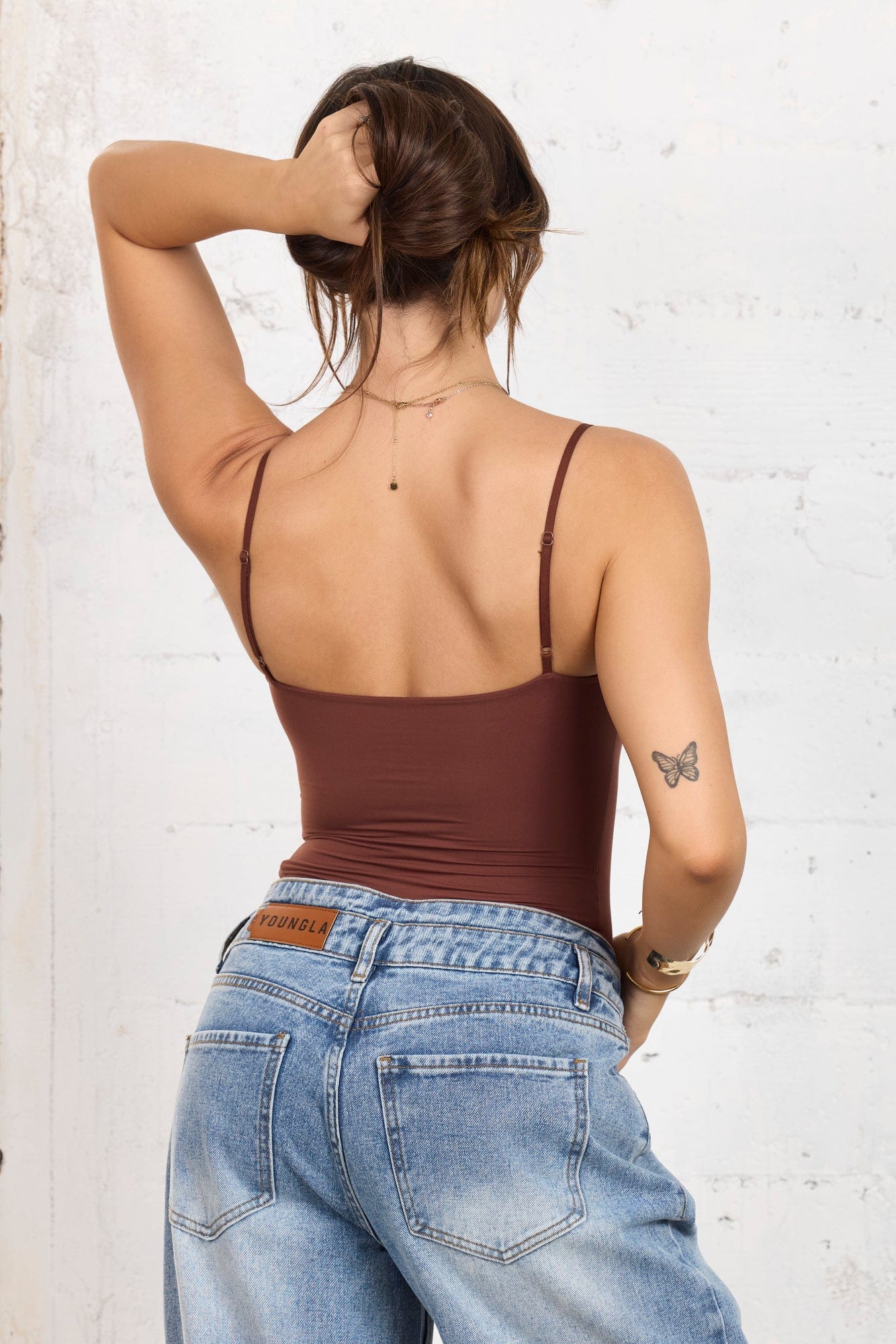 Front view of the Whisper Soft Strapless Shapewear Bodysuit on a model.