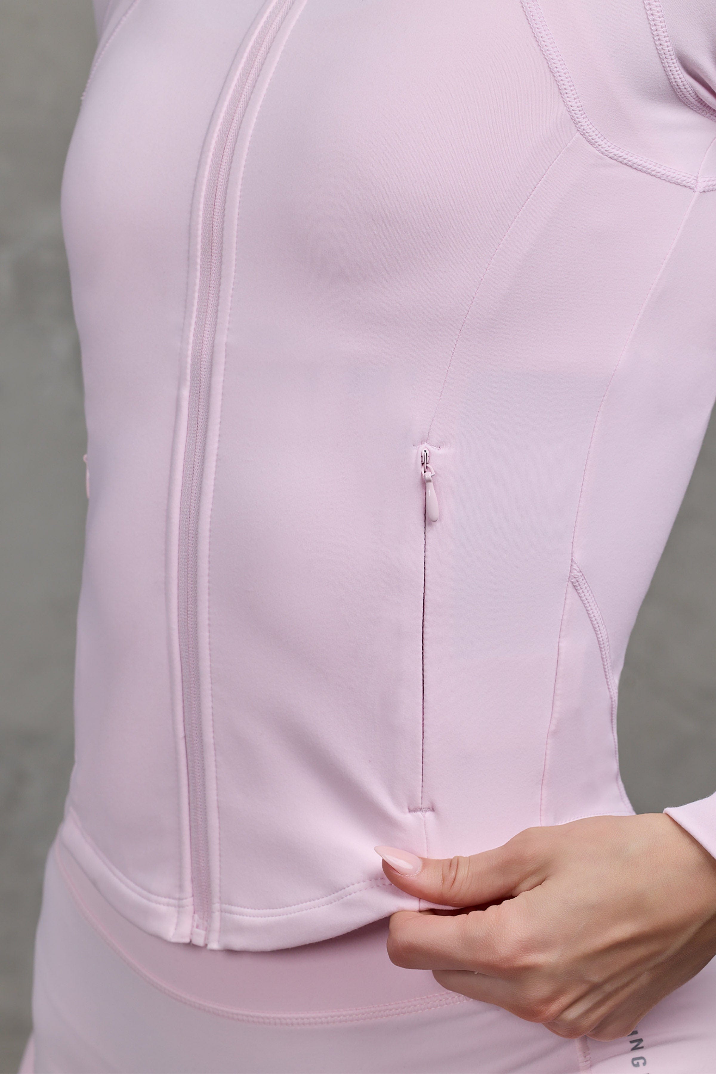 Elevate Activewear Jacket displayed on a model during a workout.