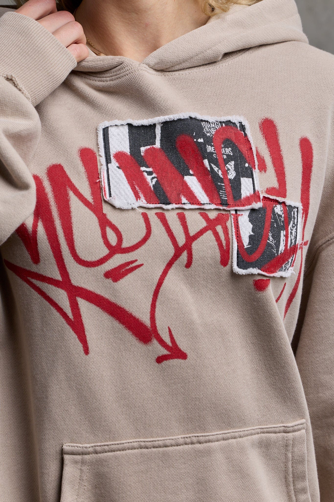 Side profile showing oversized fit of zip-up hoodie