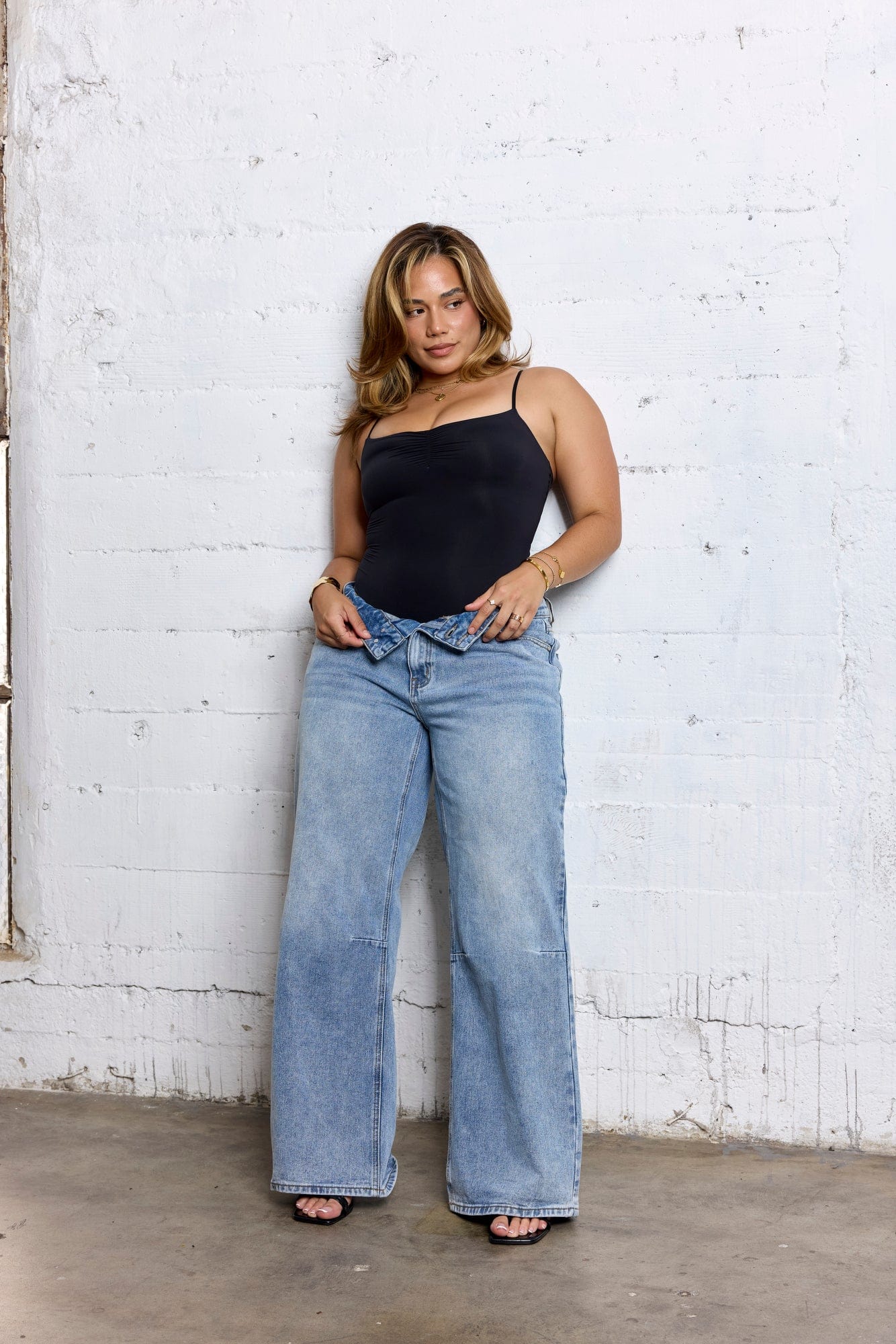 Front view of mid rise straight leg jeans on a model