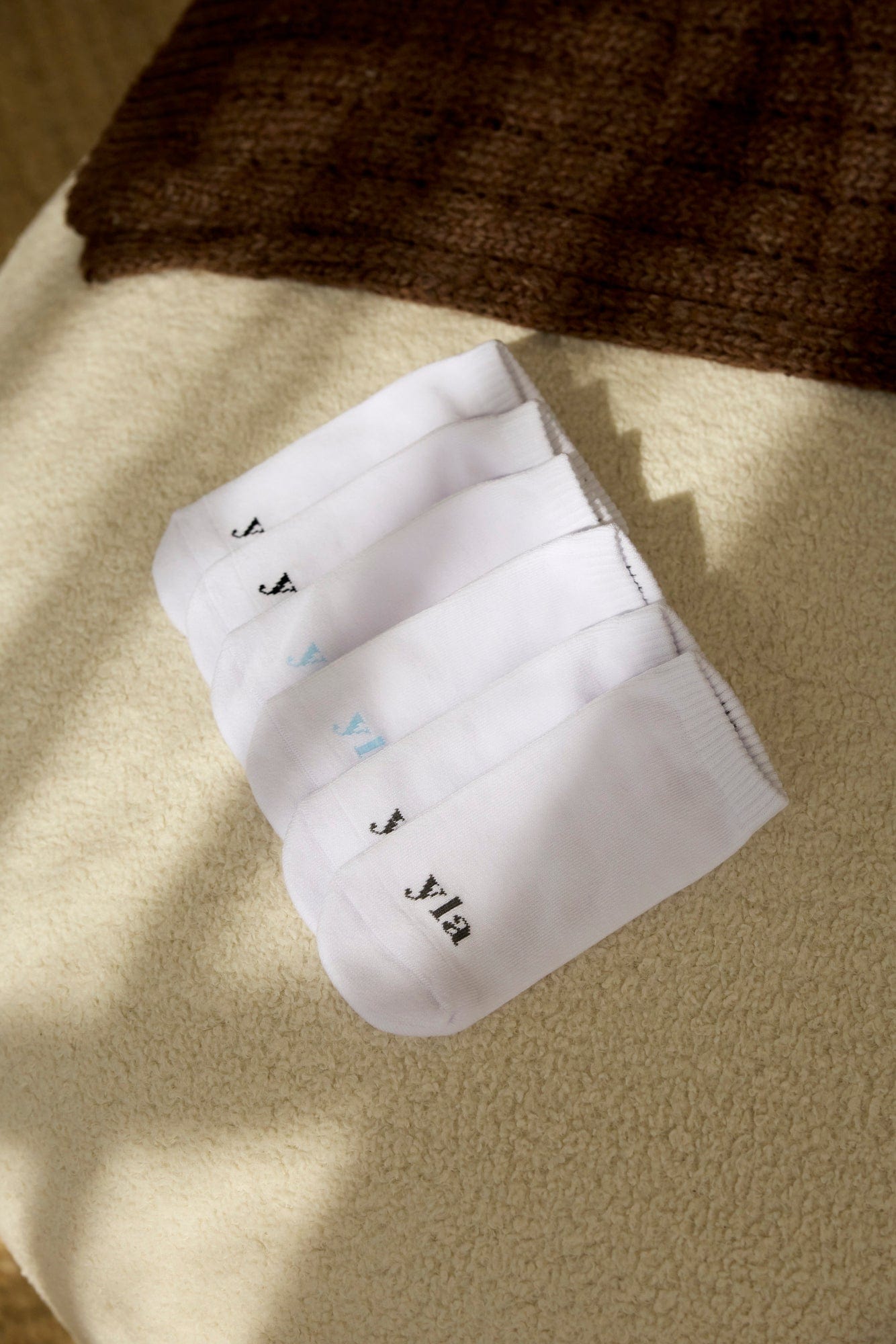 Mens ankle socks folded, showing breathable fabric texture