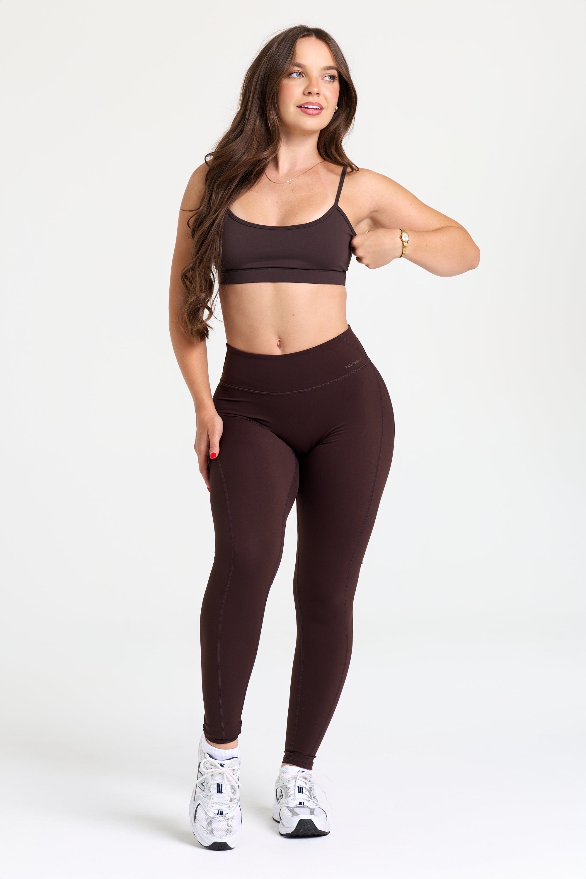 Model in Legacy Flow Leggings mid-workout, showcasing flexibility