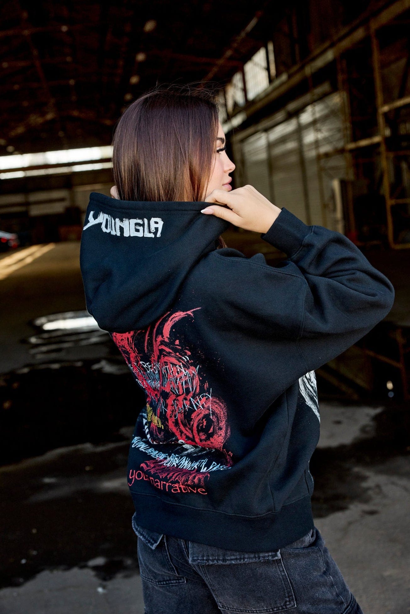 Front view of oversized zip up hoodie worn with jeans on a crisp fall day