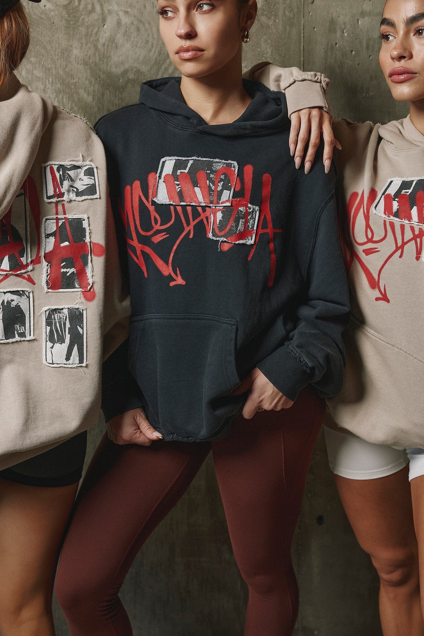Side profile showing oversized fit of zip-up hoodie