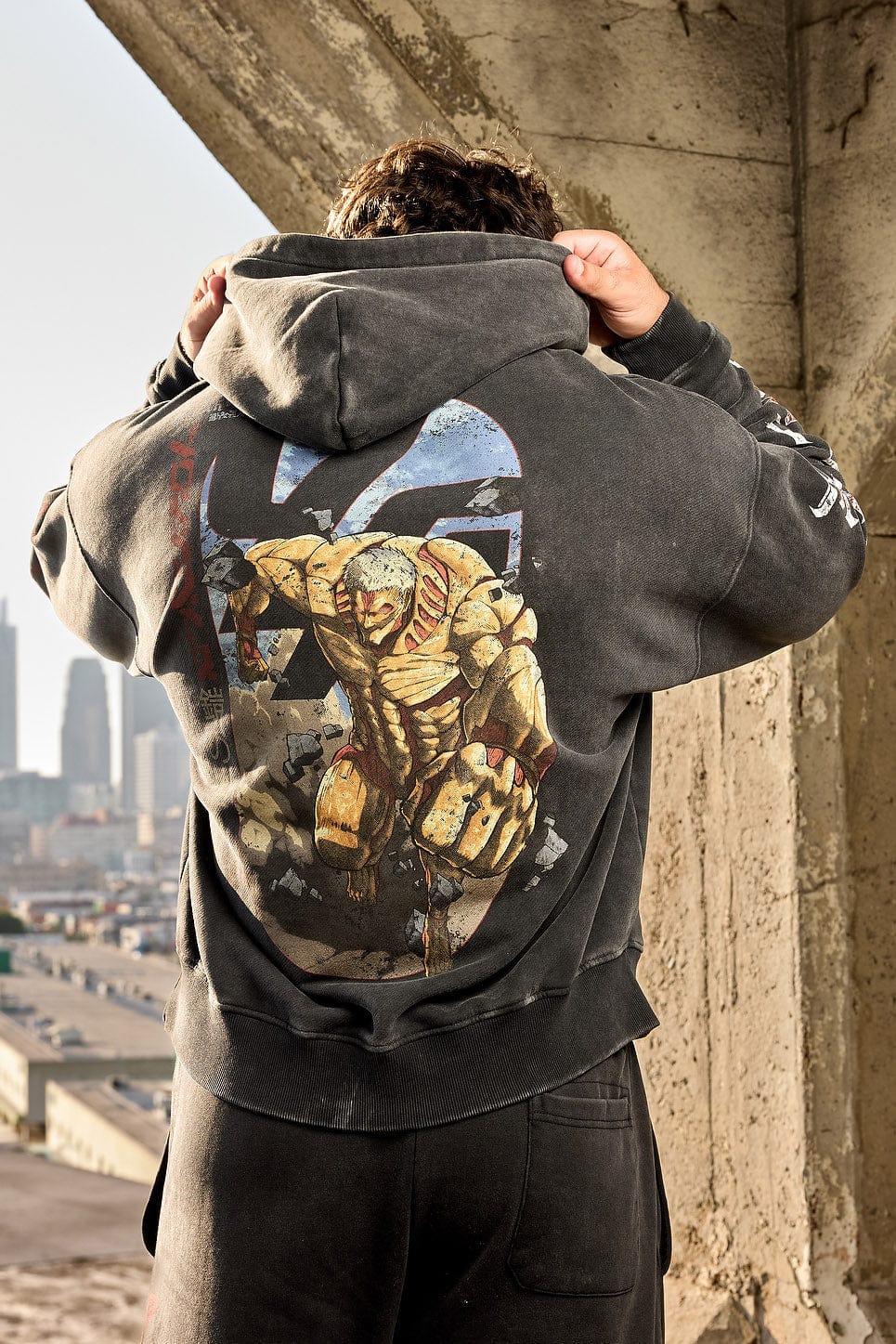 Detailed stitching and print quality of the Attack on Titan merchandise hoodie.