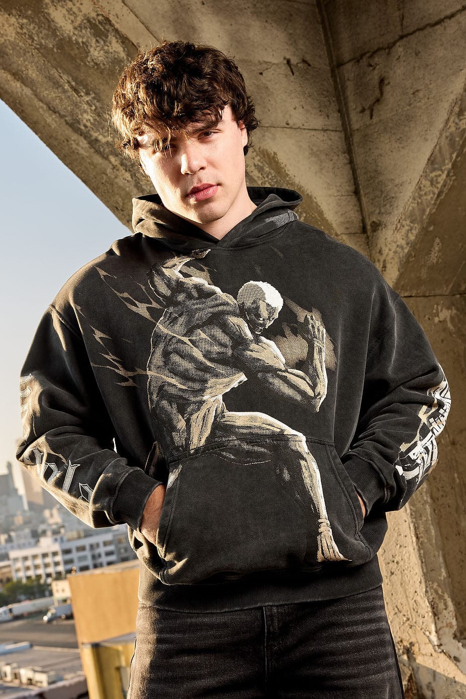 Model wearing the AOT pullover hoodie, showcasing relaxed fit.