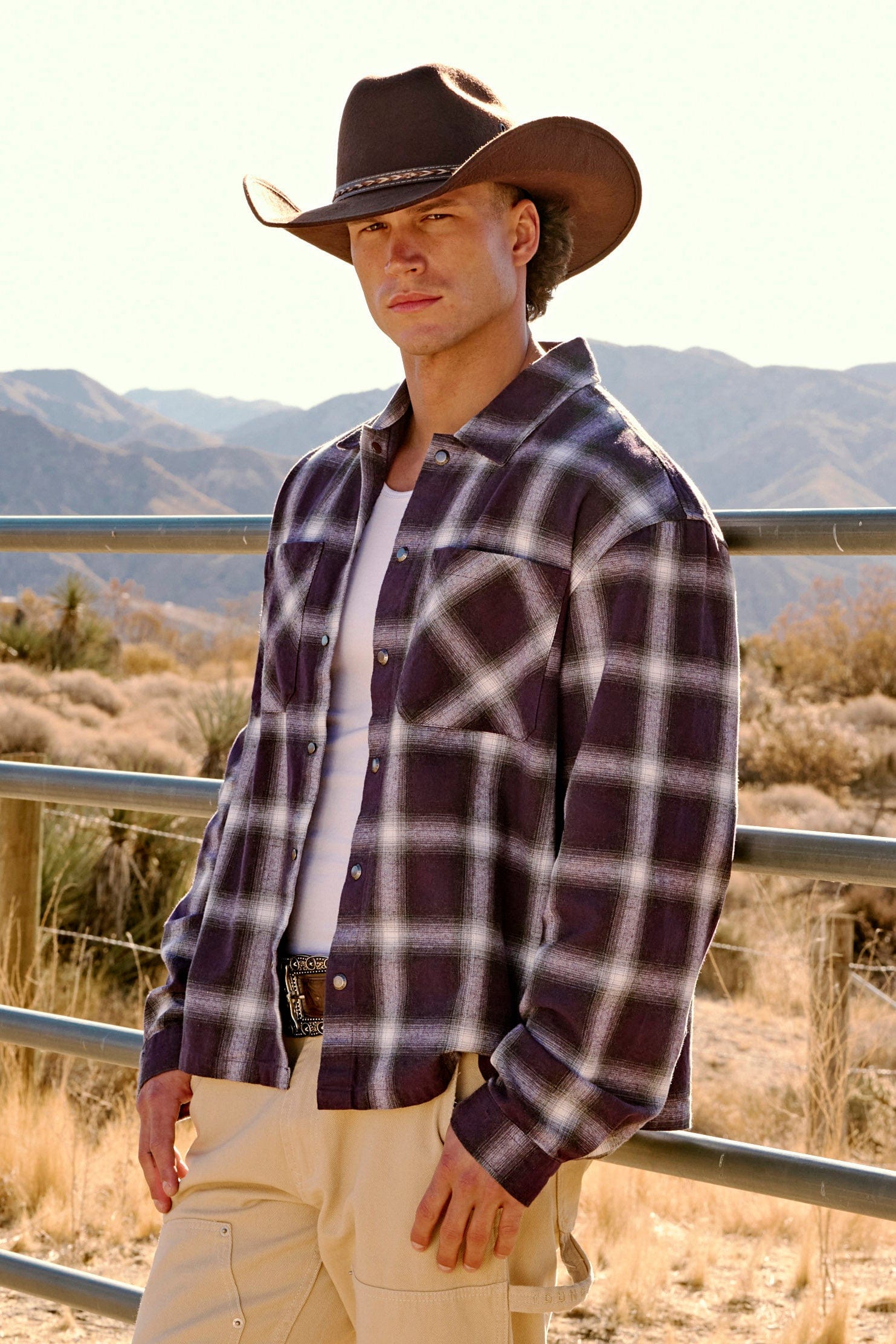 Folded flannel shirt jacket showcasing texture and dual chest pockets.
