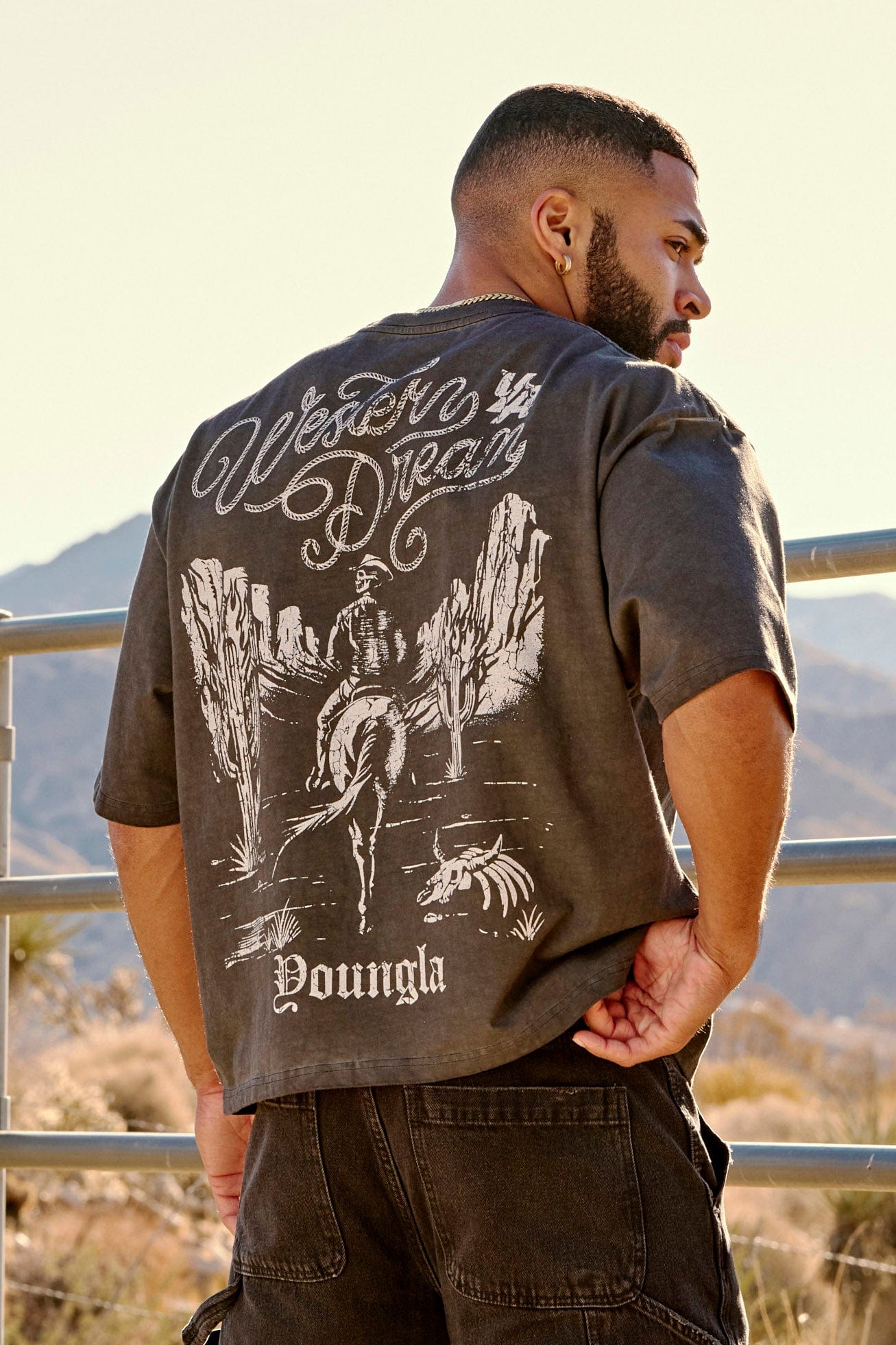Close-up of vintage graphic tee highlighting cotton fabric texture.