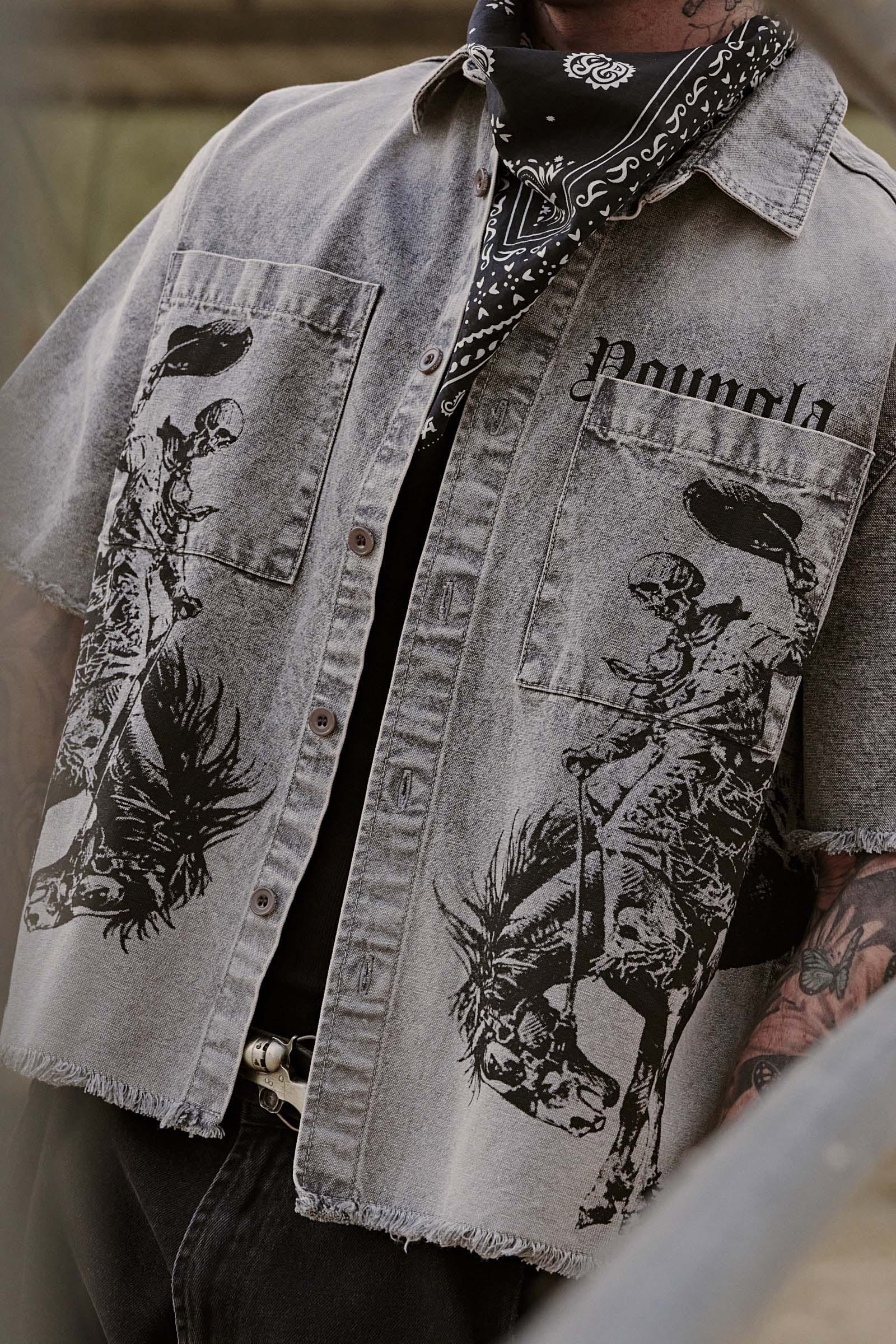 Flat lay showing front and back graphic design of button up shirt