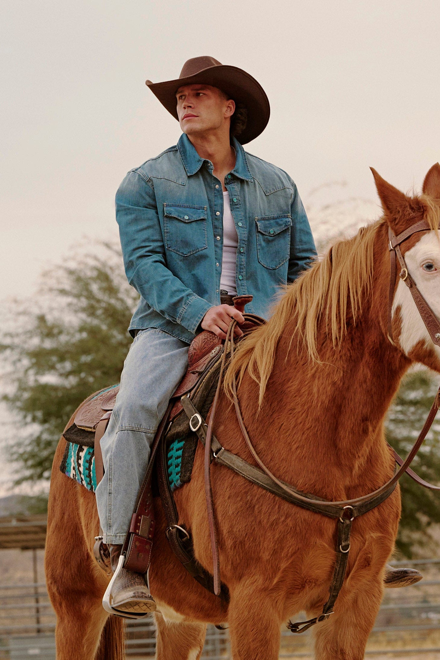 Model wearing the western denim shirt in a casual setting.