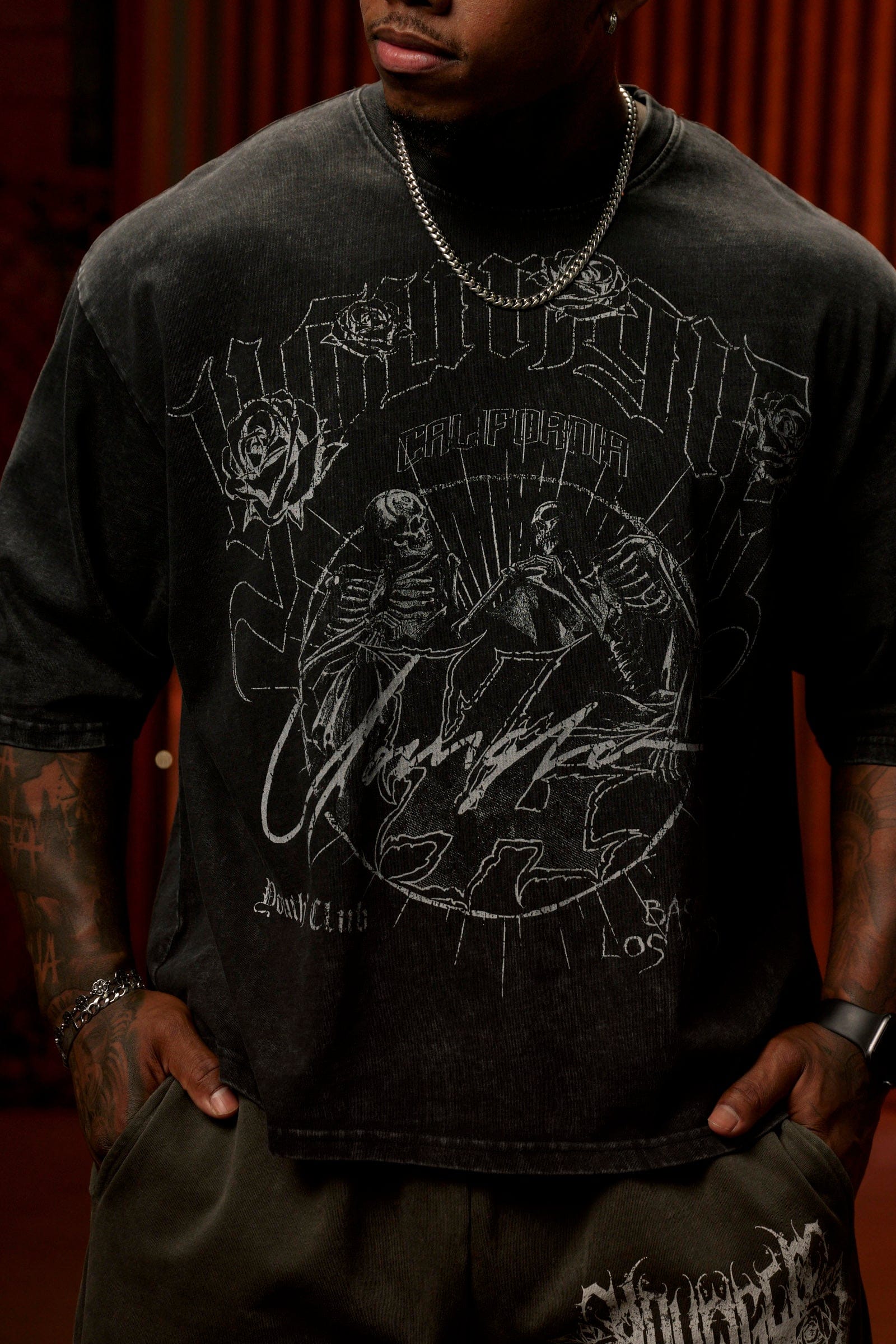 Side angle of mens acid wash tee highlighting cropped length