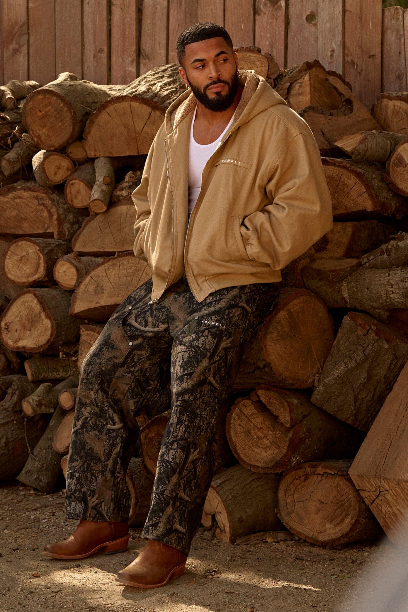 Front and back view of low-rise baggy jeans with camo print.