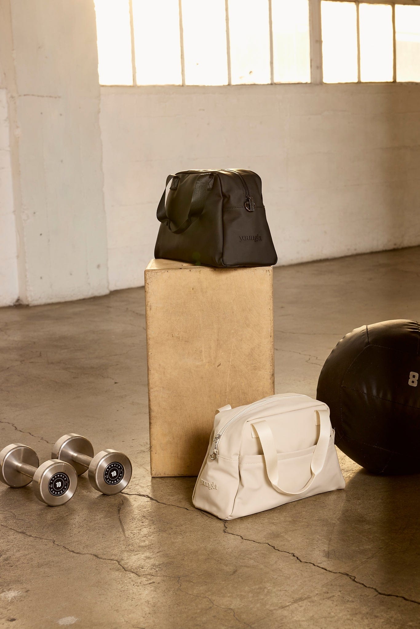 Side angle of the small duffle bag mens, highlighting its compact size.