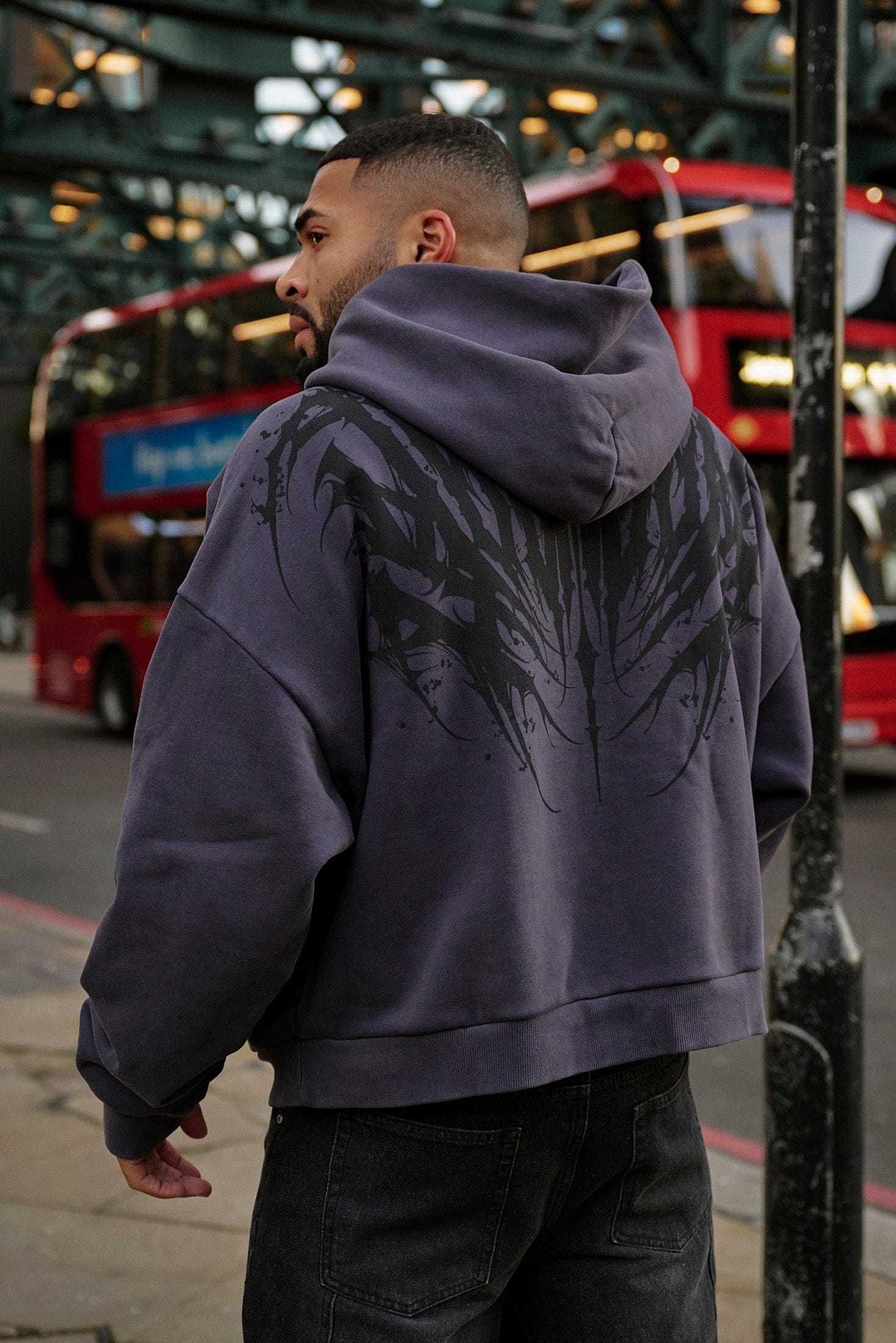 Close-up of the bold chaos graphic on the back of the oversized hoodie