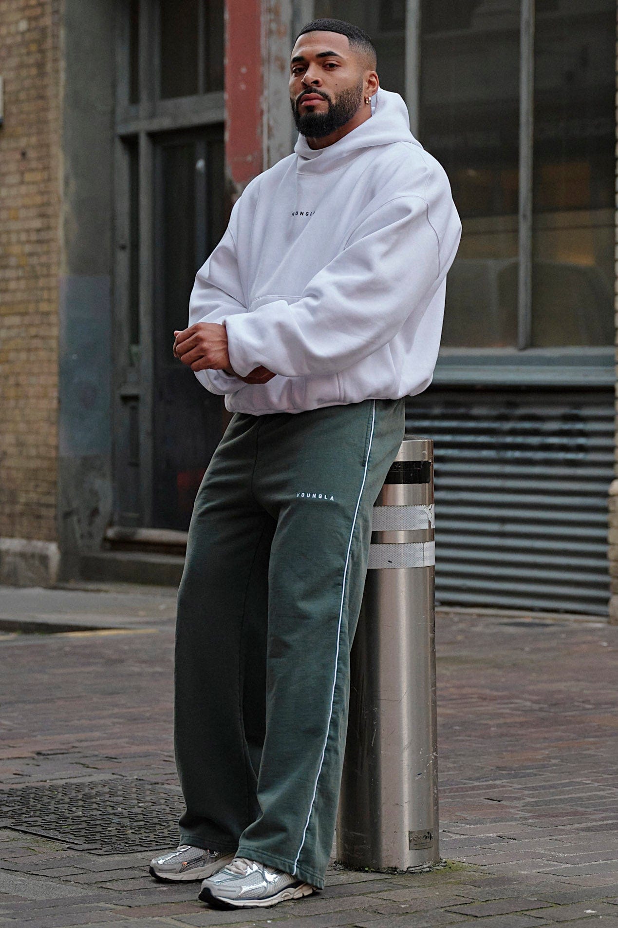 Back angle of the oversized zip up hoodie showing its unique round silhouette