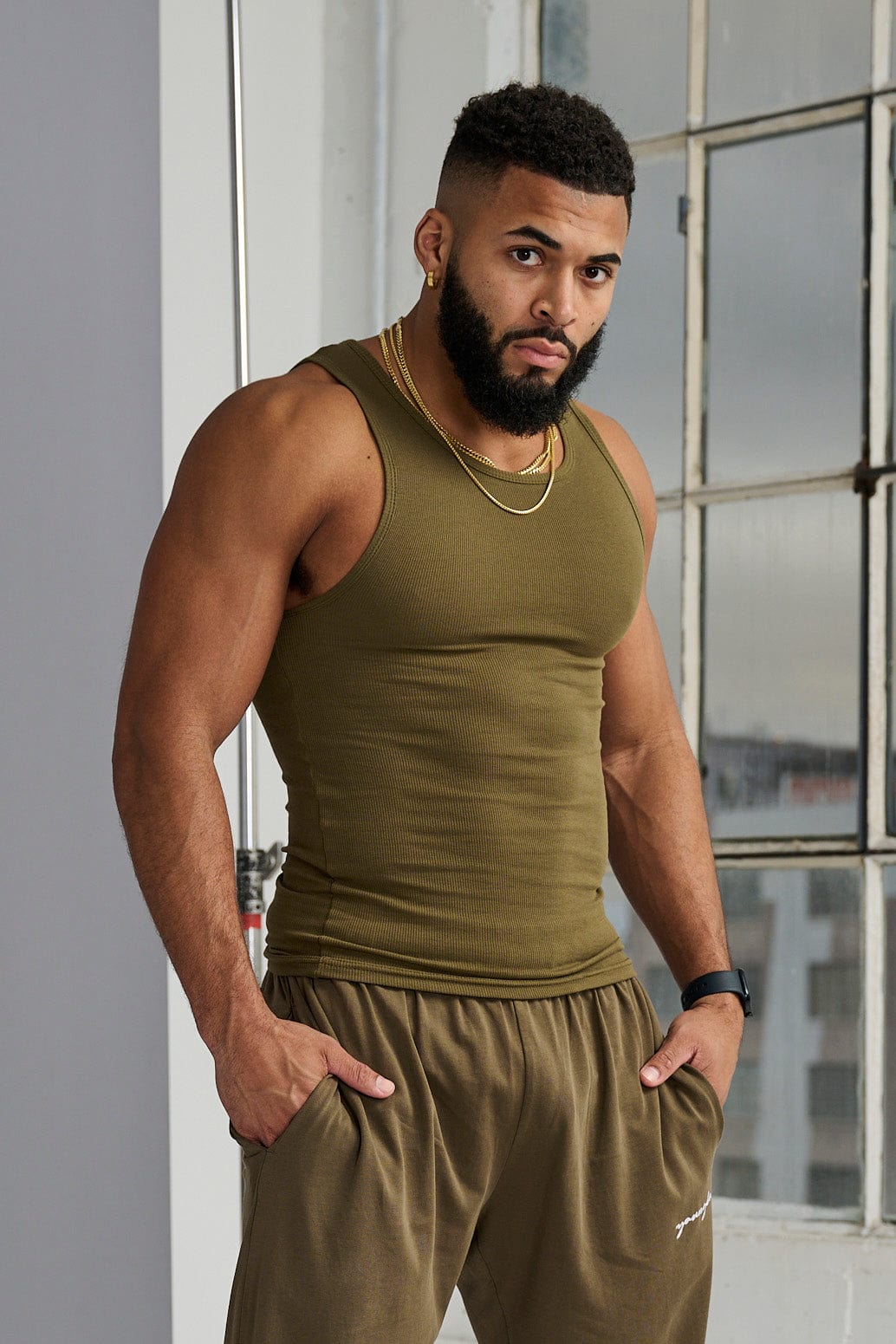 Front view of fitted white tank top worn during summer workout
