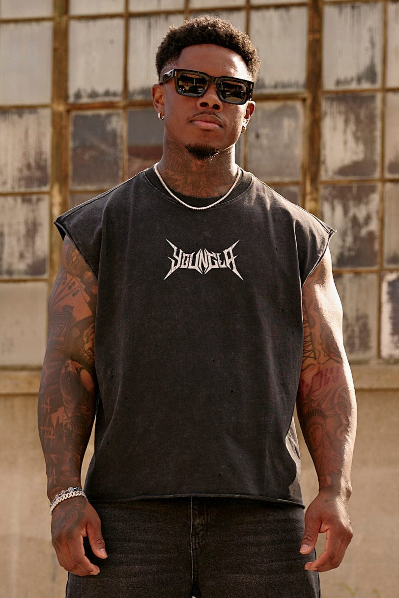 Close-up of men's cut-off tank top showing distressed fabric and logo