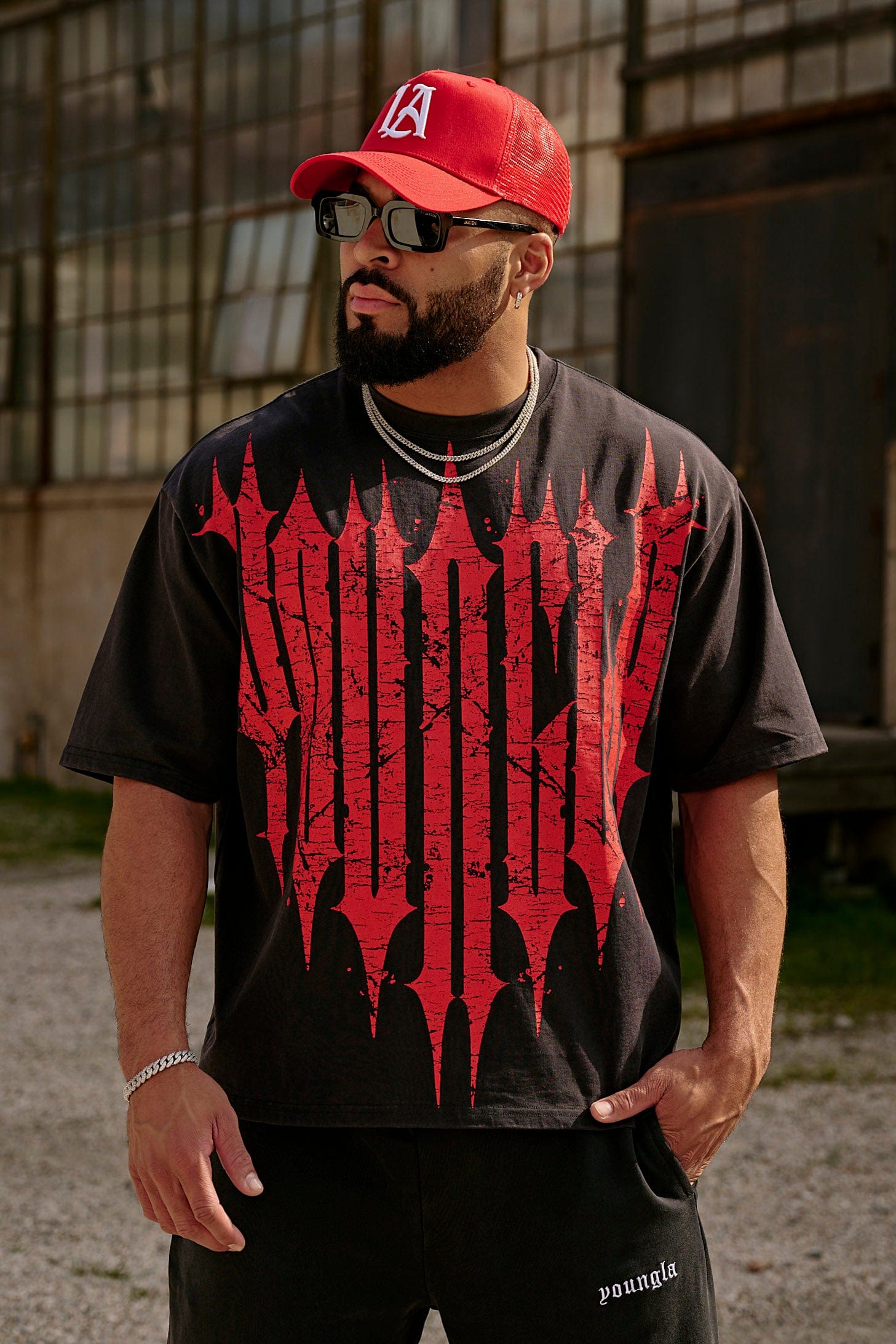 Close-up of distressed gothic graphic on oversized cotton shirt