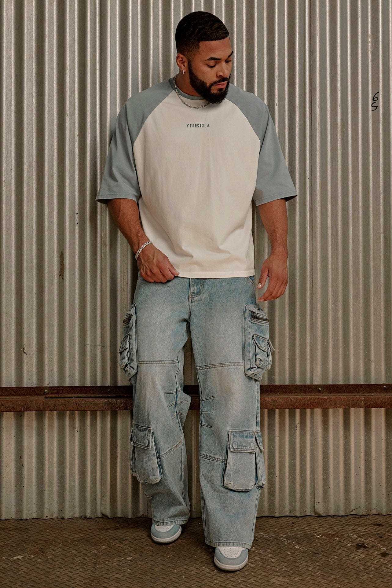 Side angle of baggy stacked jeans showcasing the relaxed fit.