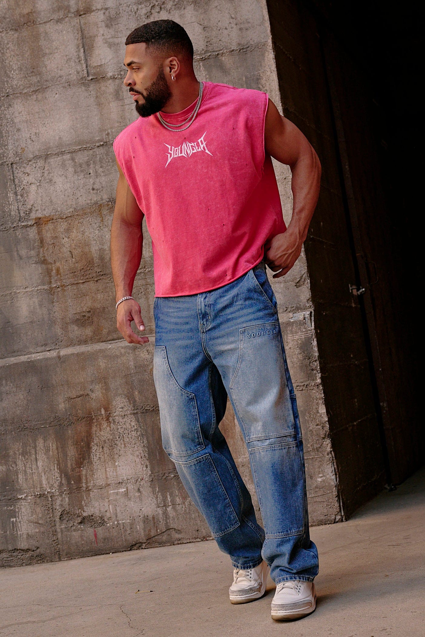 Side view of model wearing workout tank top during training